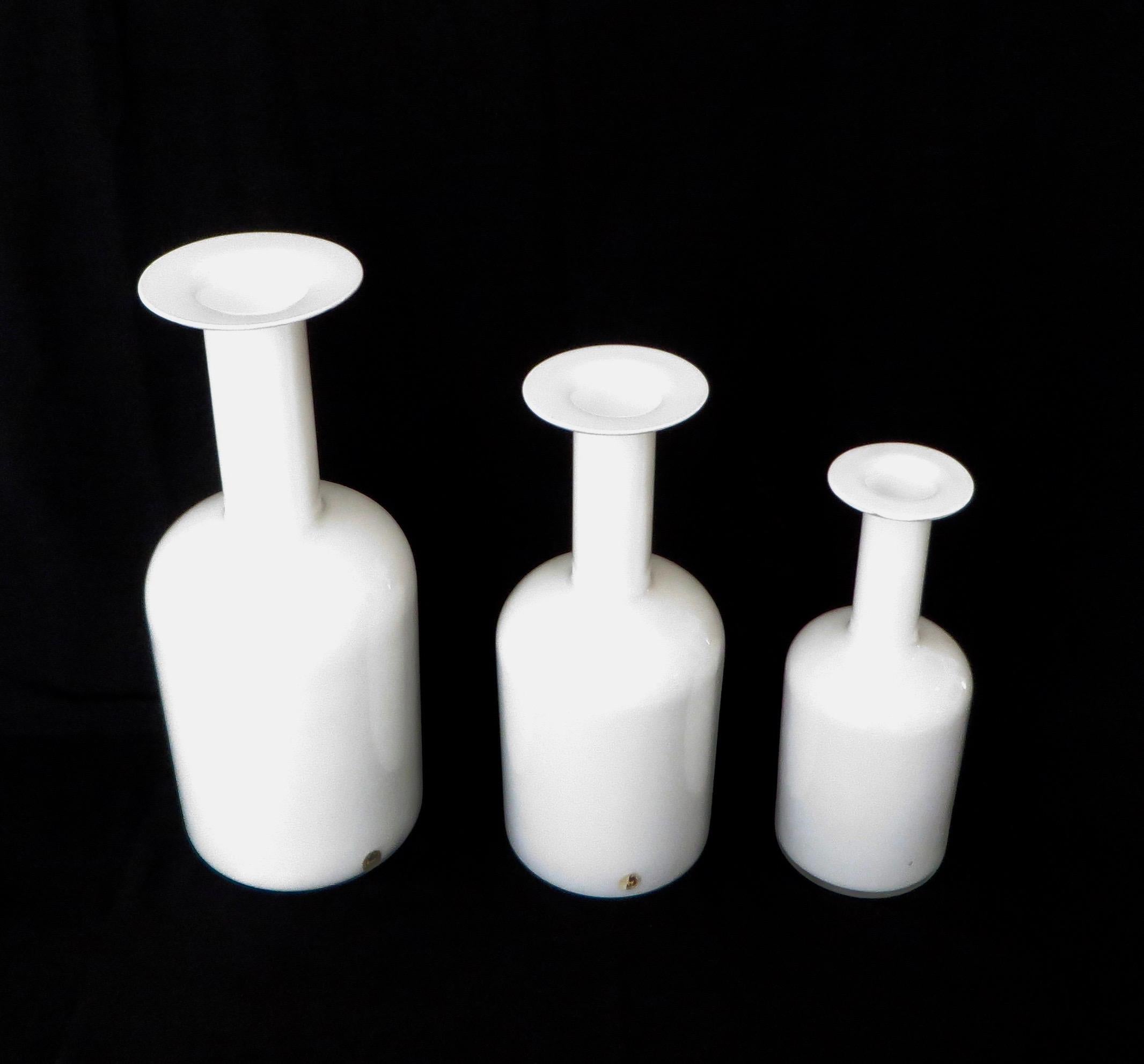 Set of three cased white mouth blown glass Vases by Kastrup
Holmegaard, Denmark, circa 1970.
Holmegaard opaque white glass Gulvvase designed by Otto Brauer in 1962, based on a 1958 design by Per Lutken.
Two with their original label.
Sizes of
