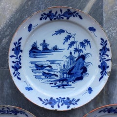 Set of three Dutch Delft Plates with garden scene and ducks, 18th Century