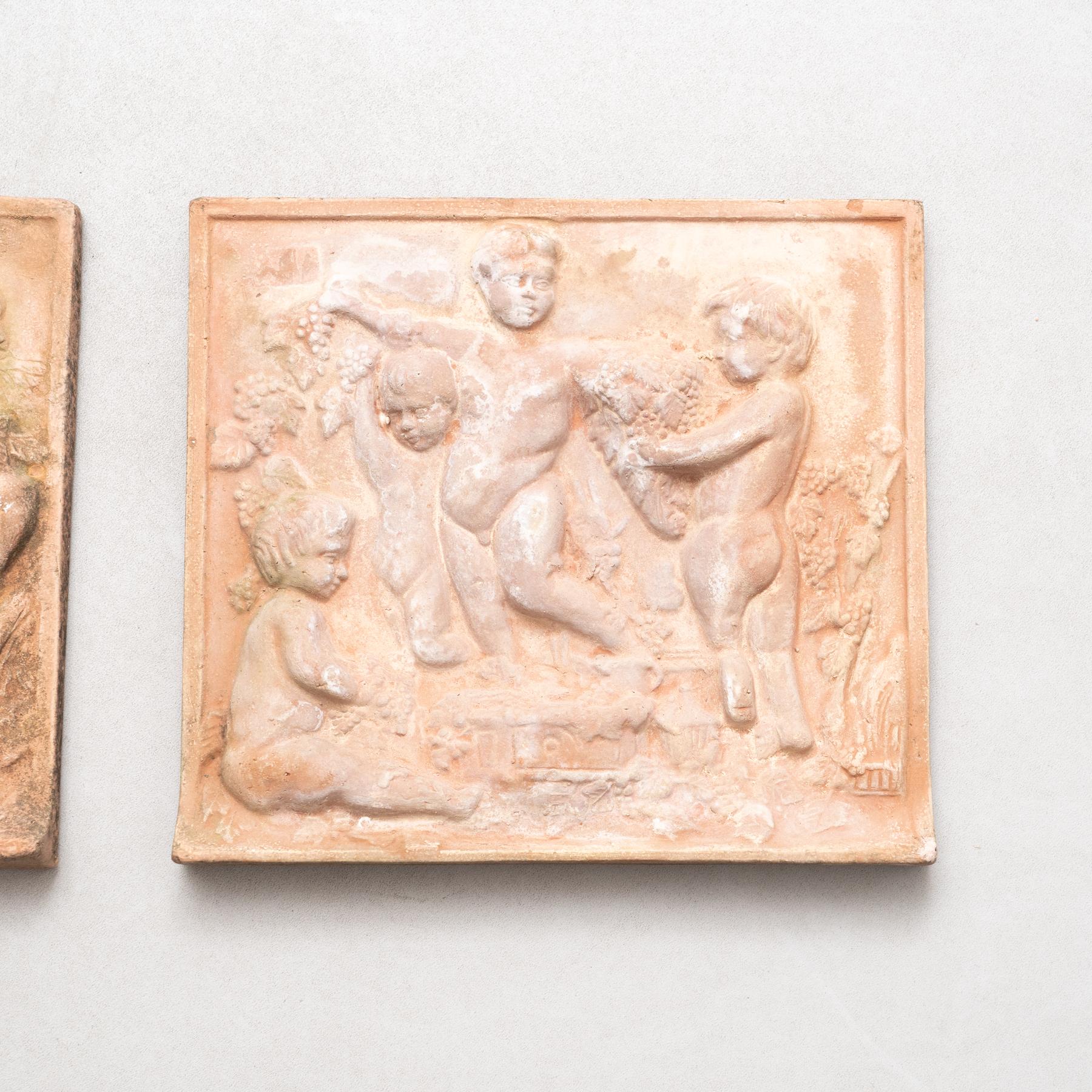 Rustic Set of Three Early 20th Century Terracotta Wall Sculptures For Sale
