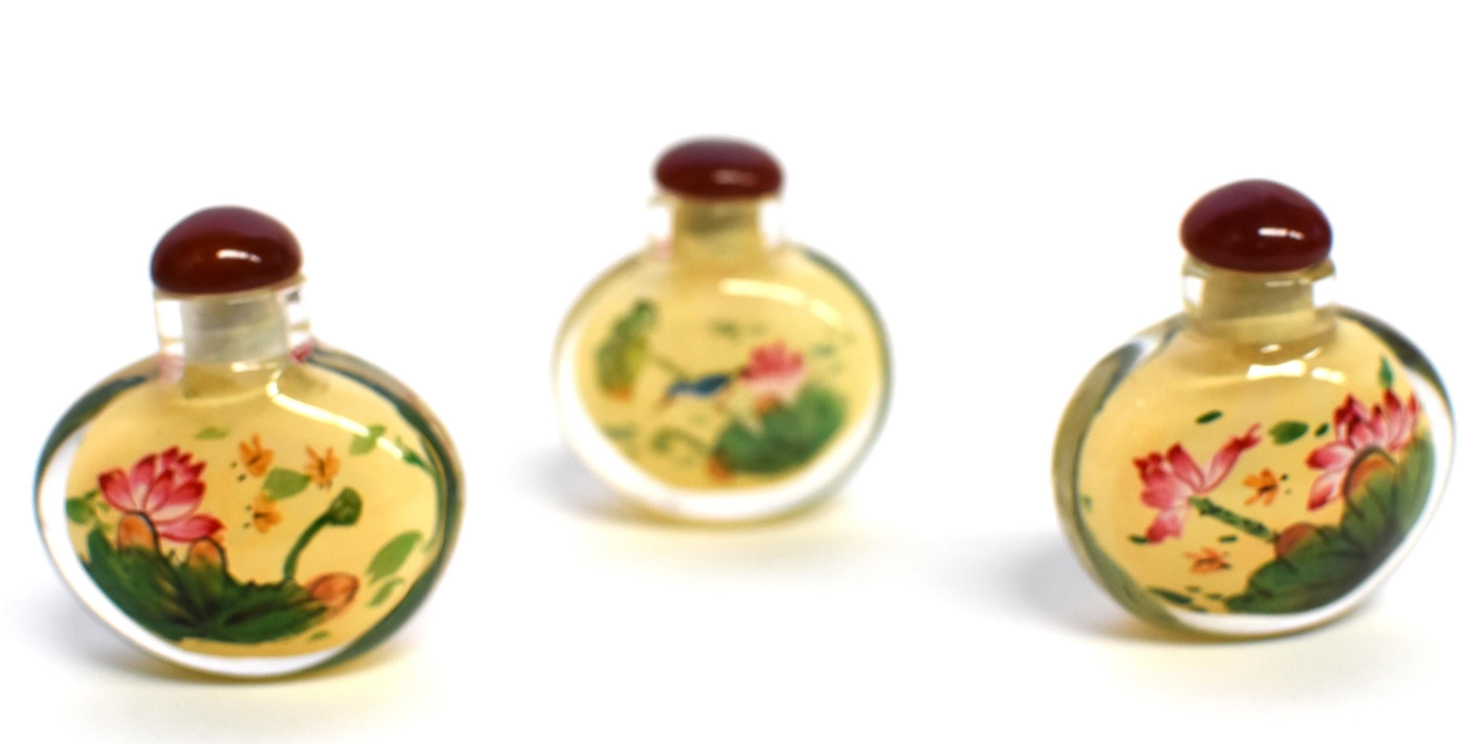 Chinese Set of Three Eglomise Reverse Painted Snuff Bottles with Lotus For Sale