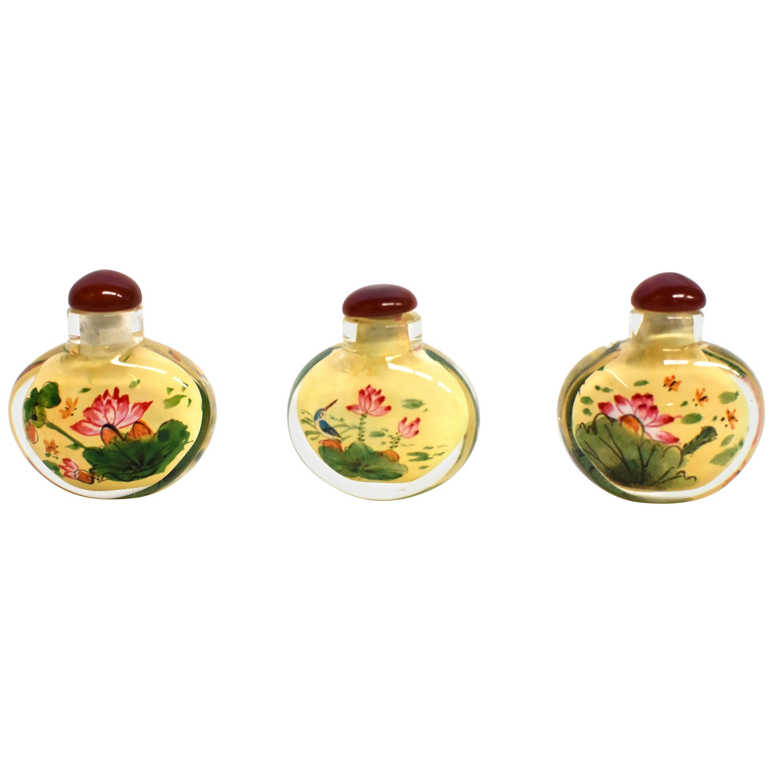 Set of Three Eglomise Reverse Painted Snuff Bottles with Lotus For Sale