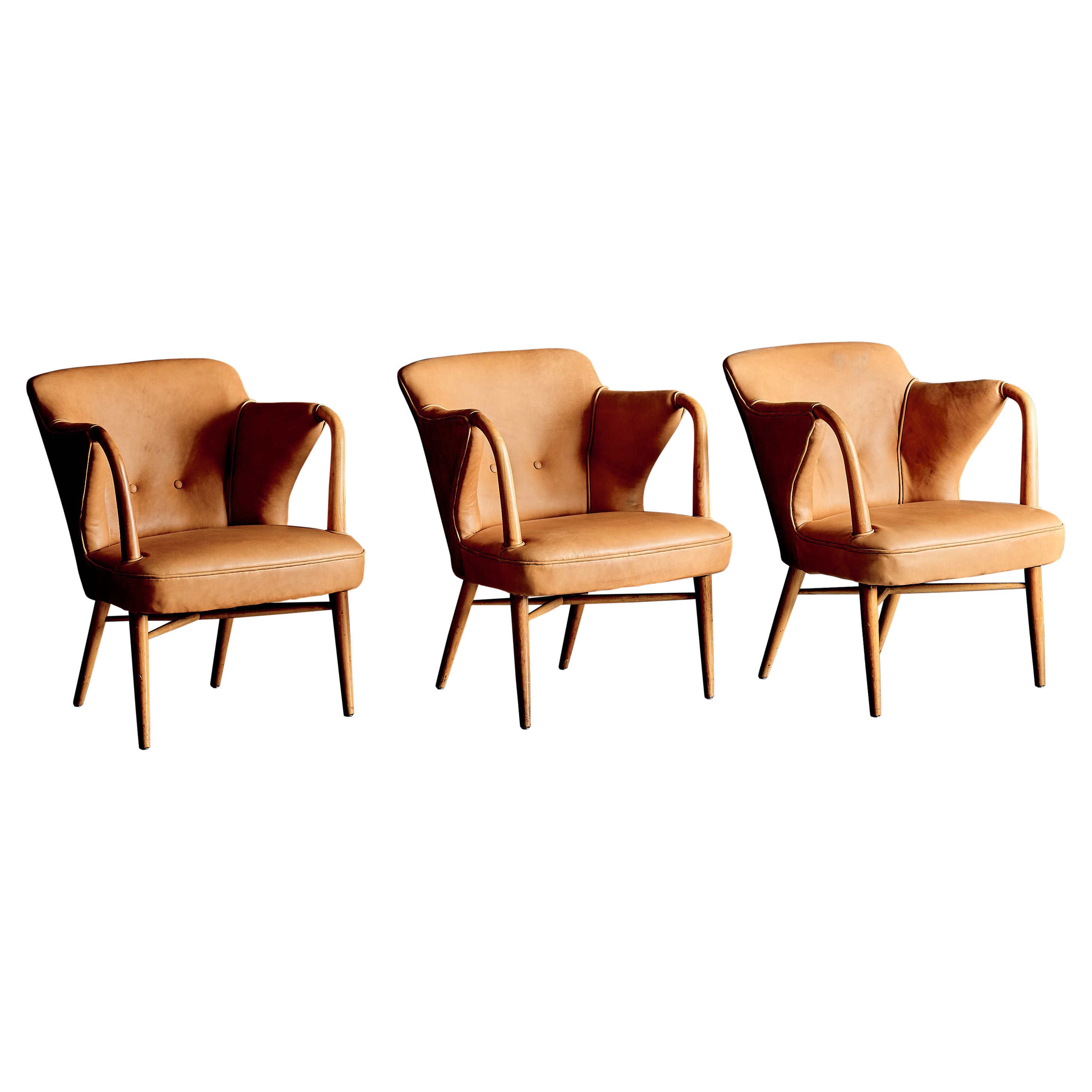 Set of three elegant Lounge Chairs upholstered in cognac Leather, Germany 1950s
