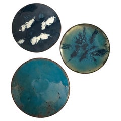 Set of three enamel on copper small dishes