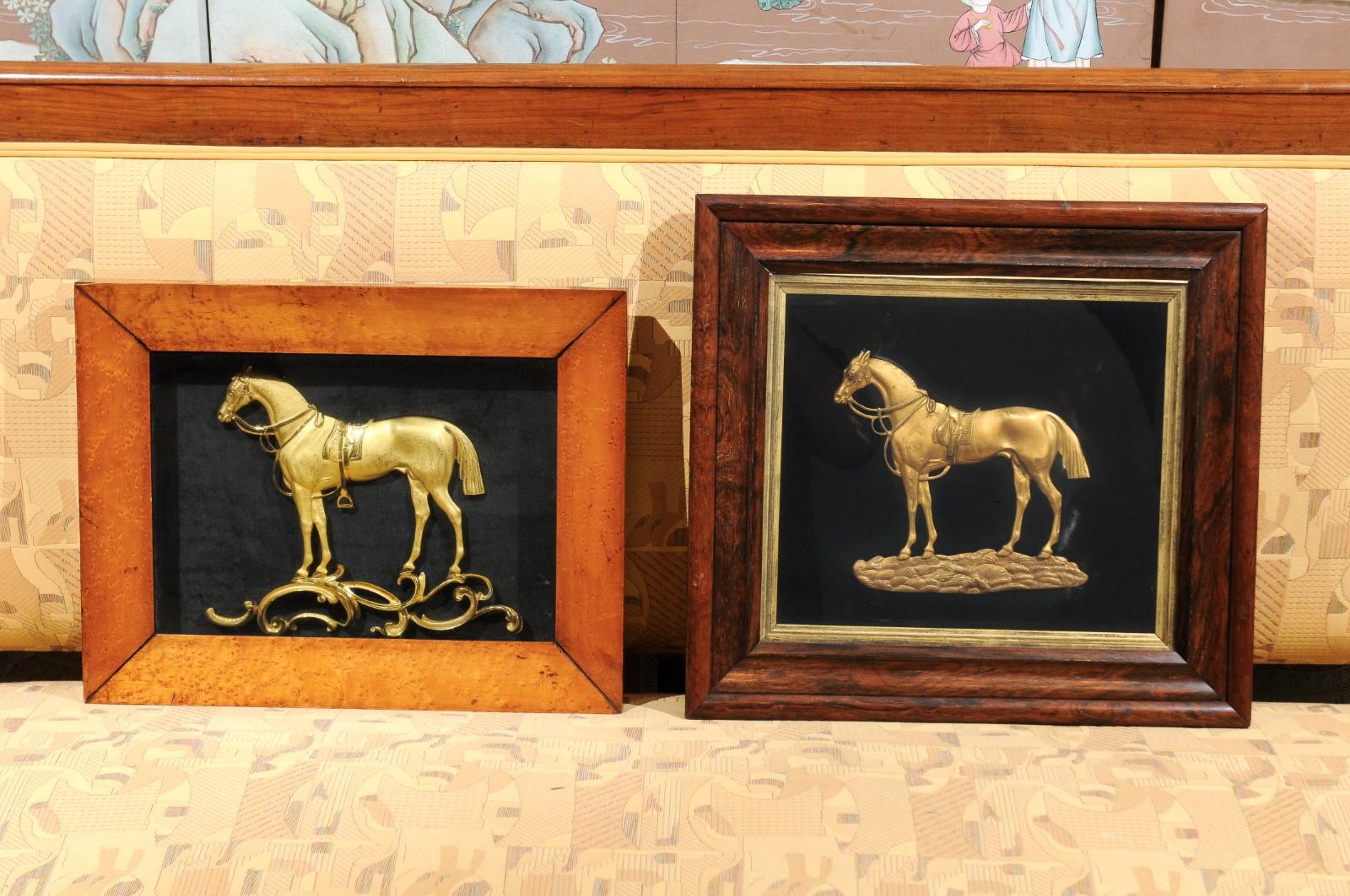 A set of three mid-19th century English gilt bronze horses mounted on black velvet in wooden and gilt frames.