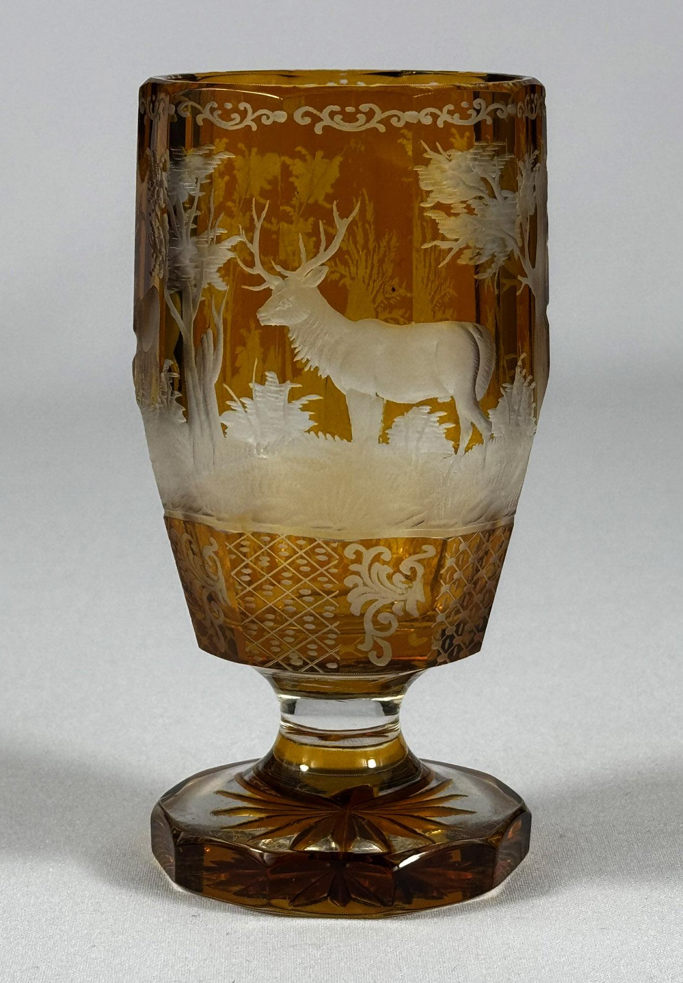 Hand-Crafted Set of three engraved goblets, cut with amber glaze, 20th century For Sale