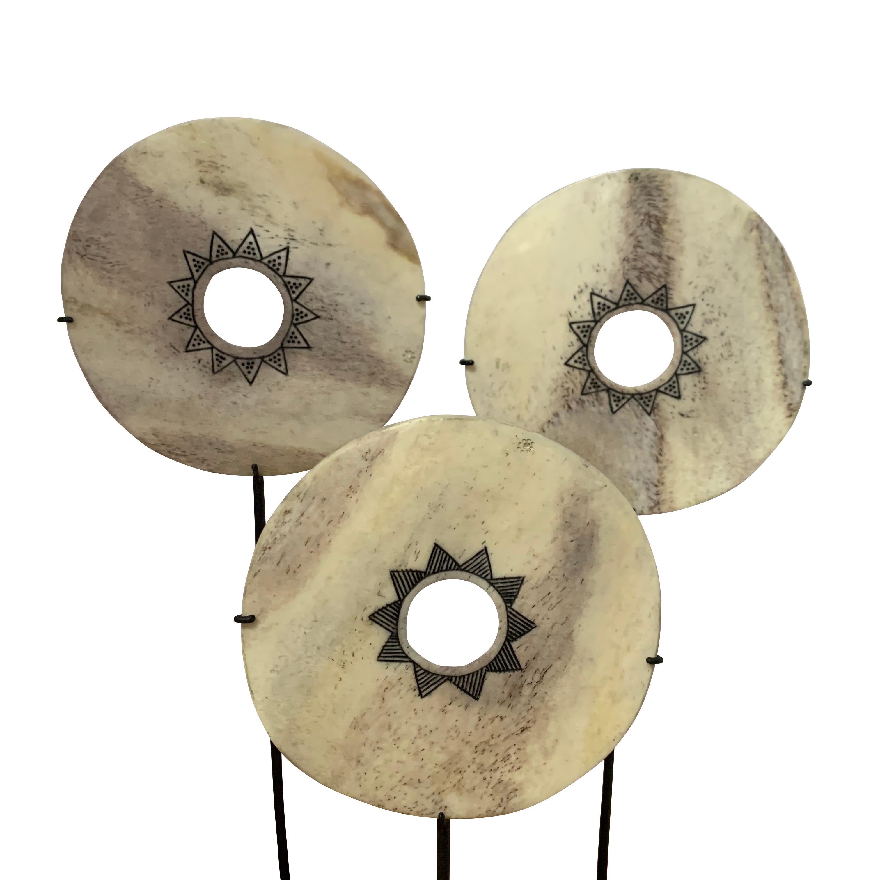Indonesian white bone disc with decorative black engraving
Discs measure 4