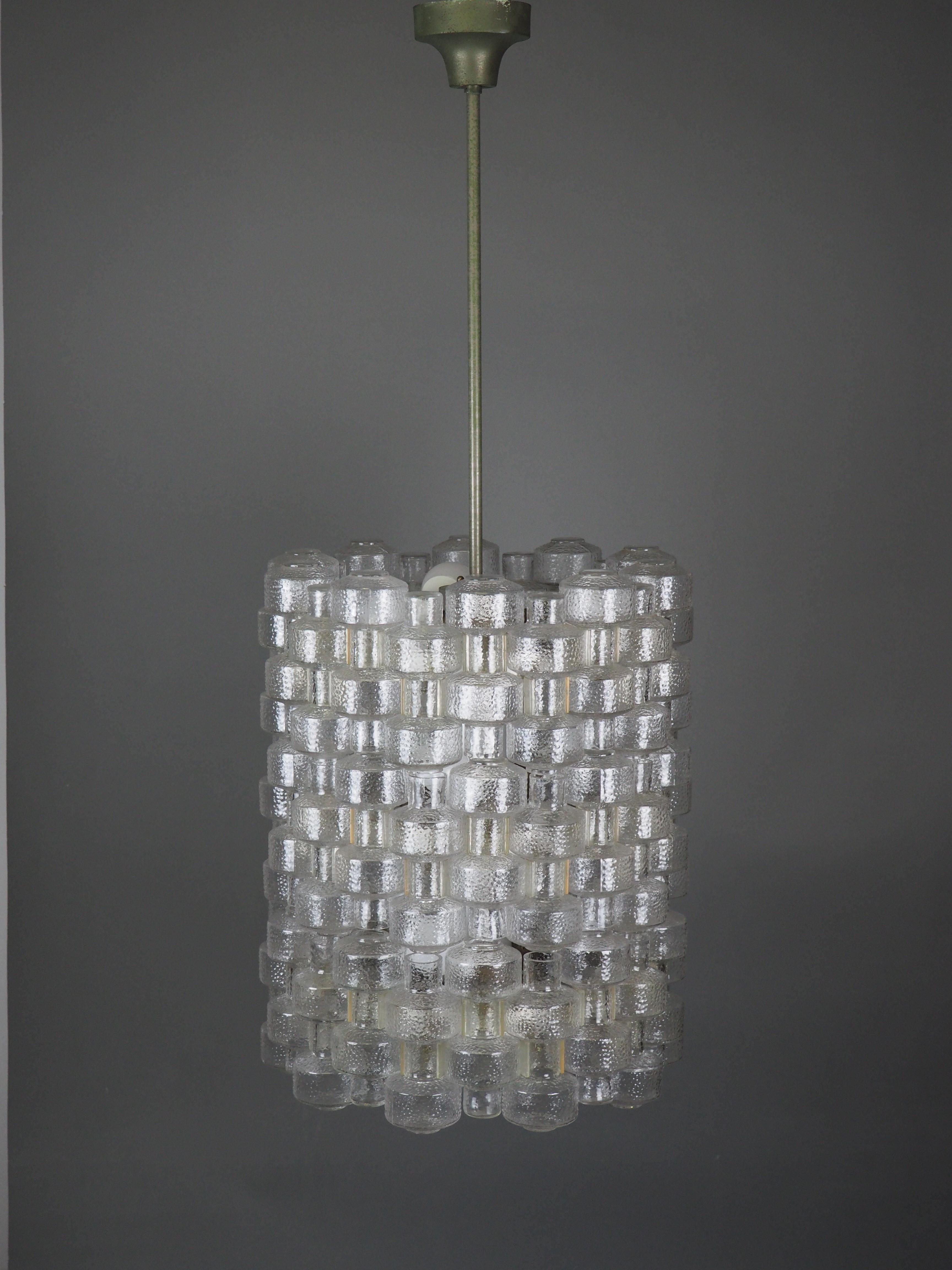 Stunning set of midcentury nine-light glass chandeliers designed by Gert Nyström for Orrefors, Sweden, circa 1950s.
This rare chandeliers are made of 66 glass elements, aluminum and metal which have a old patination.

Socket: 9 x e27 for standard