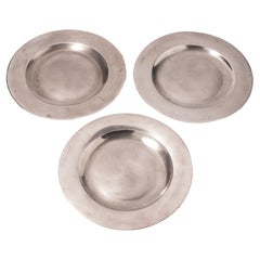 Set of three flat rim pewter plates, c. 1775-1800