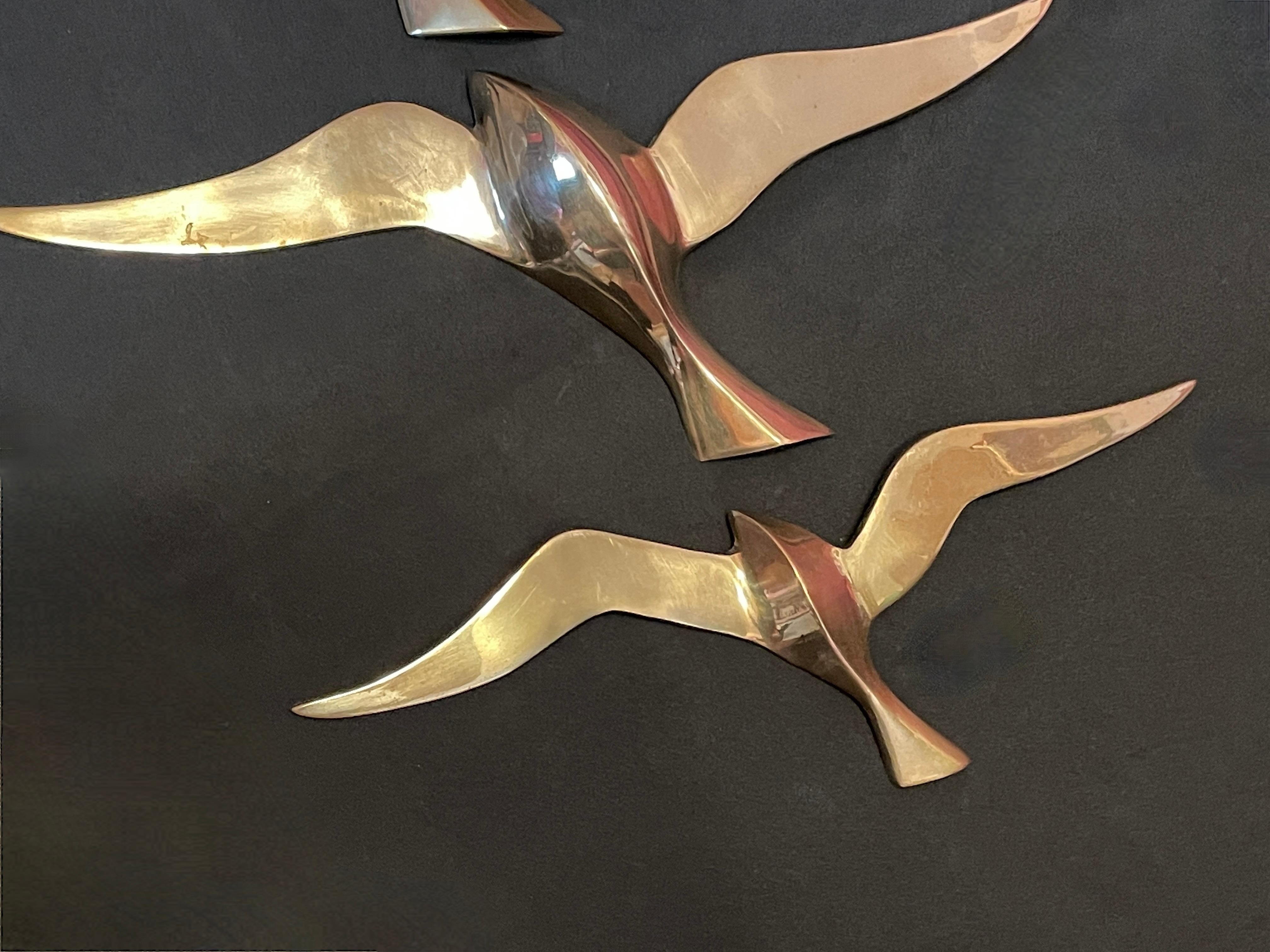 brass swallows
