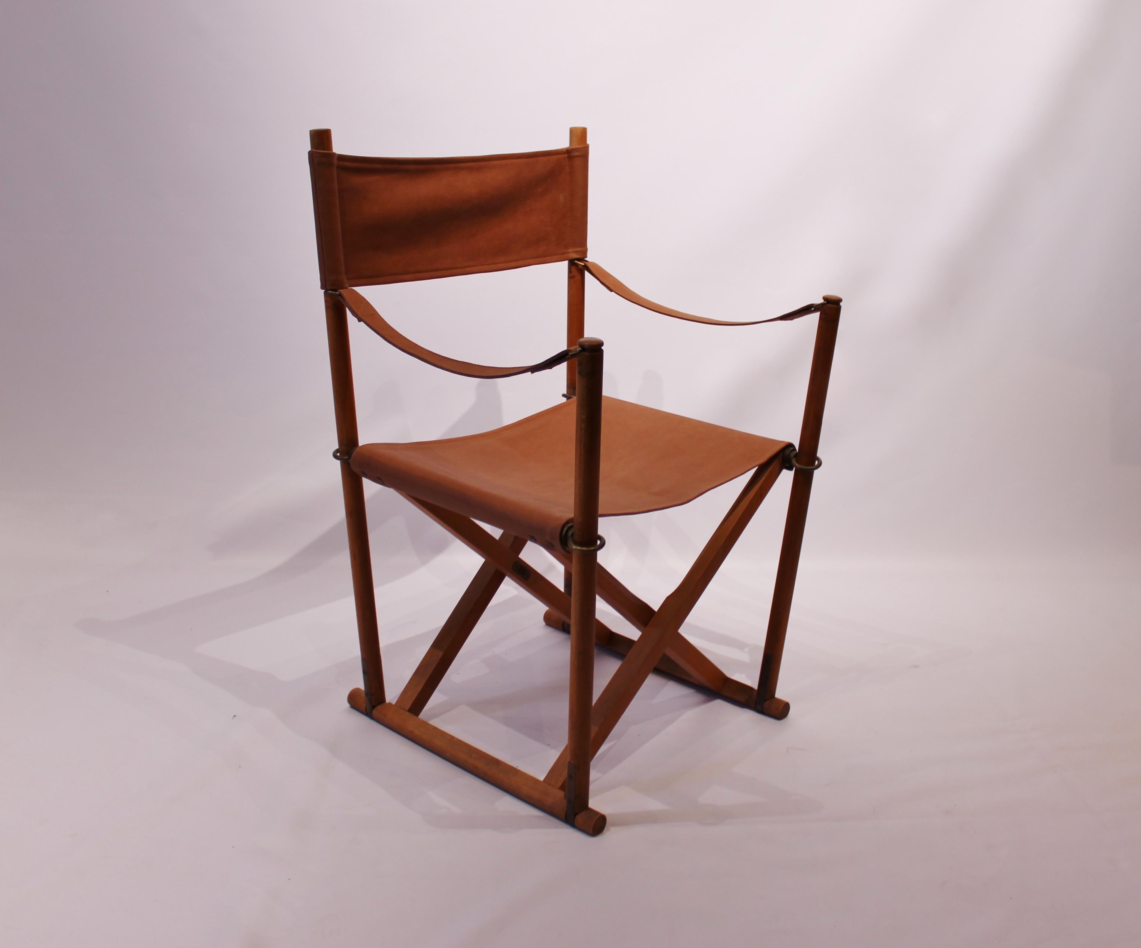 Set of three folding chairs, model MK99200, designed by Mogens Koch in 1932 and manufactured by Internal Denmark in the 1960s. The chairs are in polished beech, with brass rings and patinated leather seats. The chairs can be sold separately if