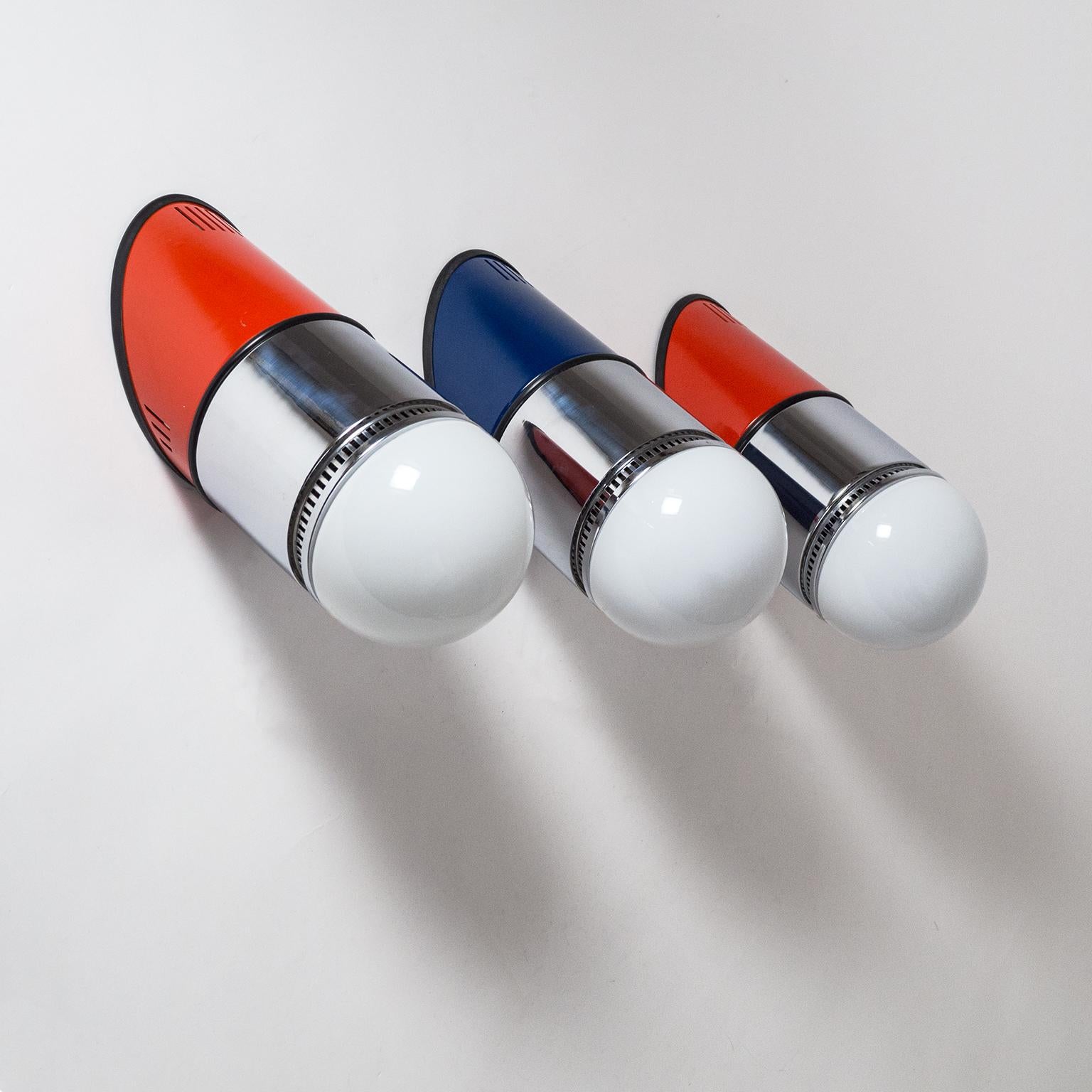 Set of three large Postmodern wall lights designed by Gianni Celada for Fontana Arte, 1980. Set at an angle of 45° these large wall lights (model 'Sisten') are made of chromed and lacquered steel with opaline glass diffusers. Can be mounted pointing