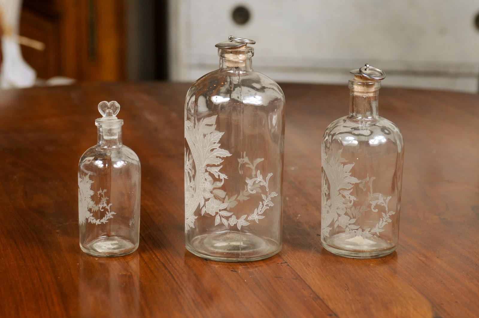 Set of Three French 19th Century Glass Vanity Bottles with Etched Floral Décor 1