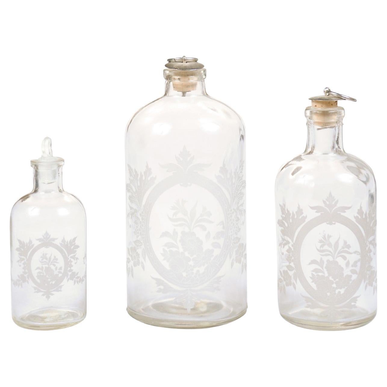 Set of Three French 19th Century Glass Vanity Bottles with Etched Floral Décor