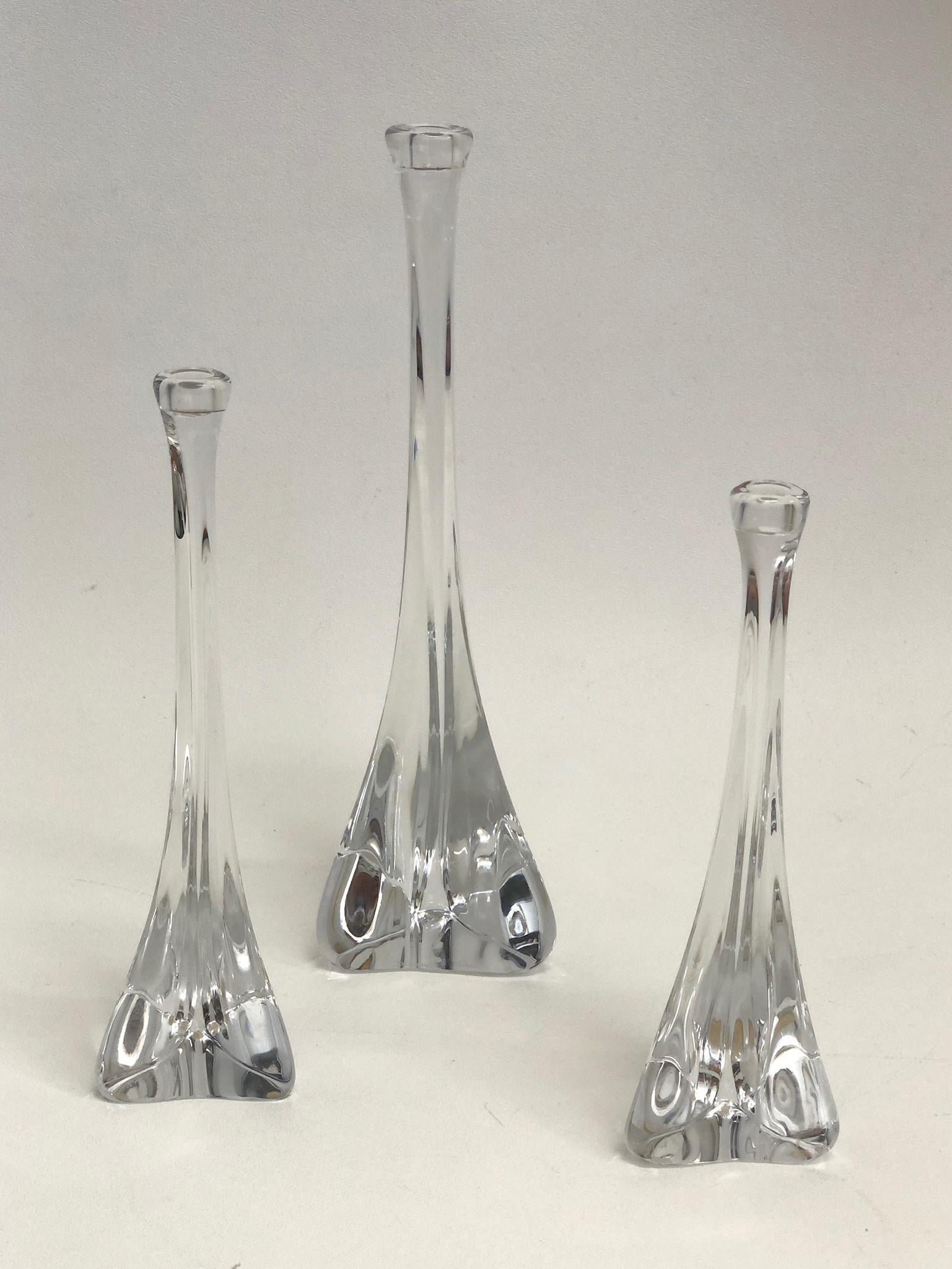 1970’s set of three French crystal candle holders by Daum.
This are hand blown with a triangular shaped bases.
They are all signed Daum France (see detail photos).

Measurements: 
L- 13” High 4” Wide 4” Deep.
M- 10.25” High 3” Wide 3”