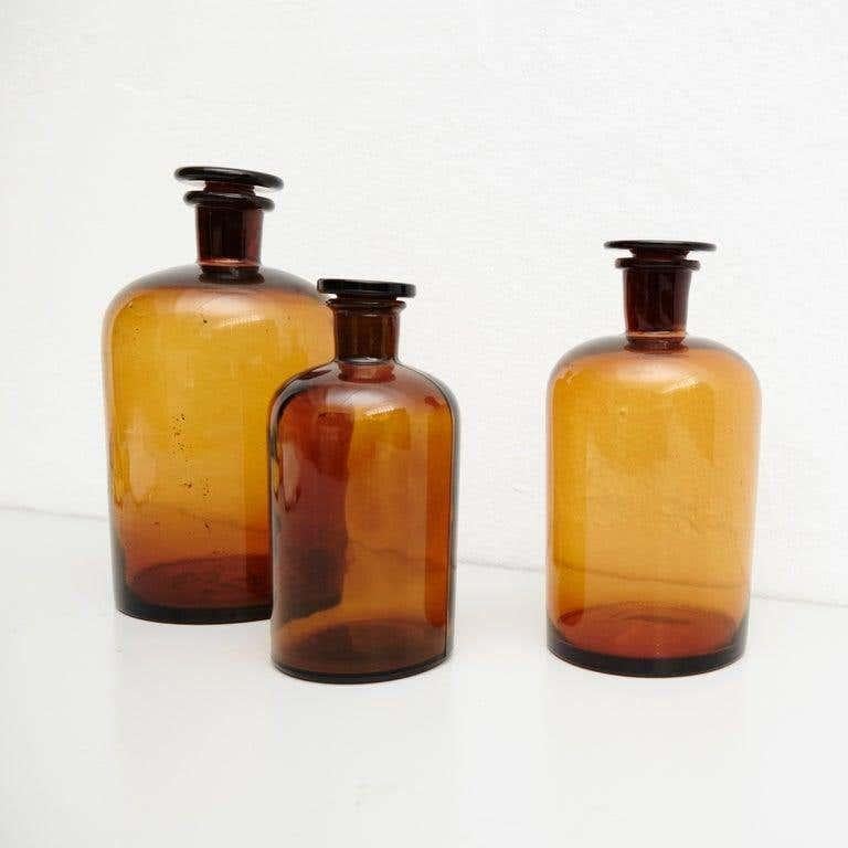 Rustic Set of Three French Vintage Amber Glass Pharmacy Bottle, circa 1930 For Sale