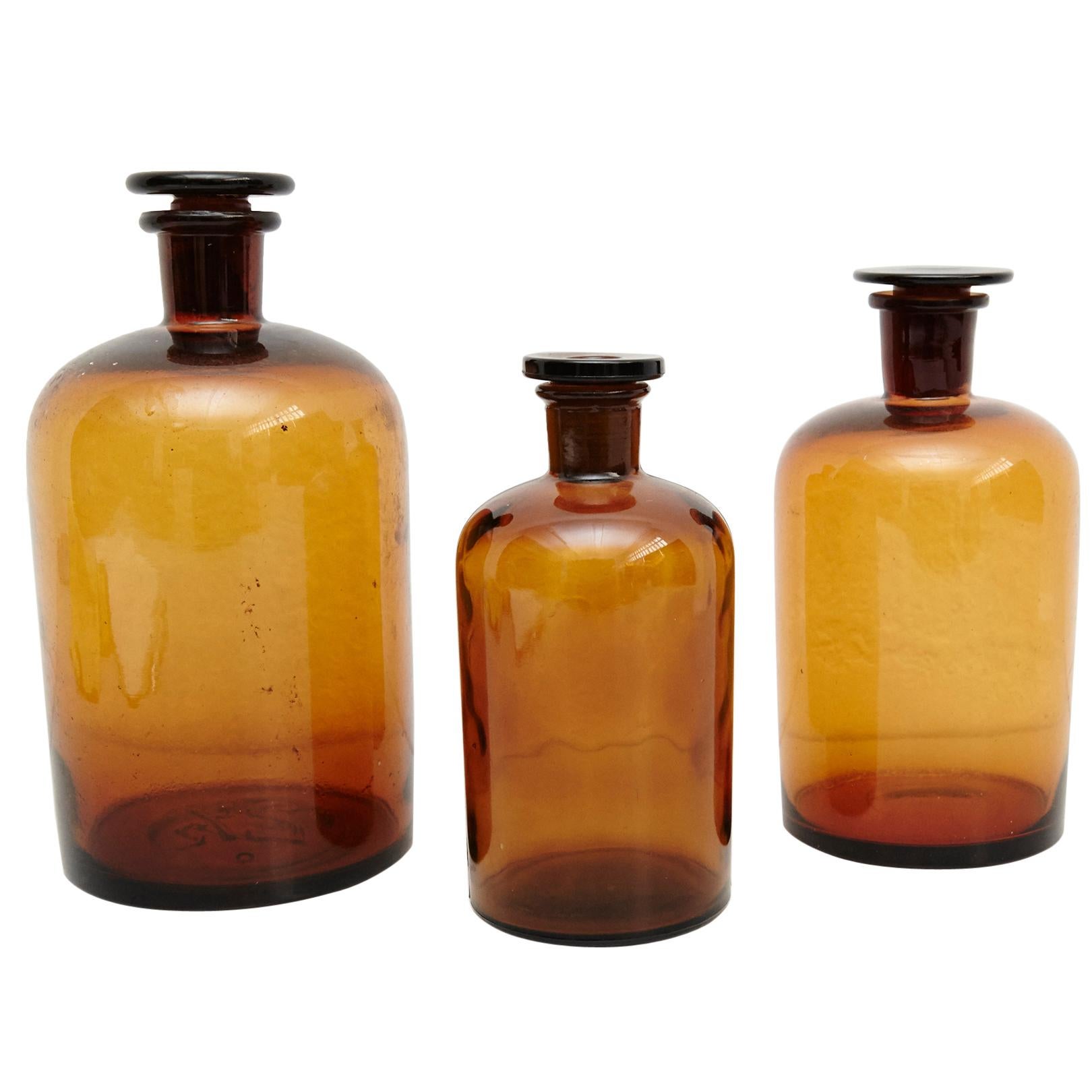 Set of Three French Vintage Amber Glass Pharmacy Bottle, circa 1930