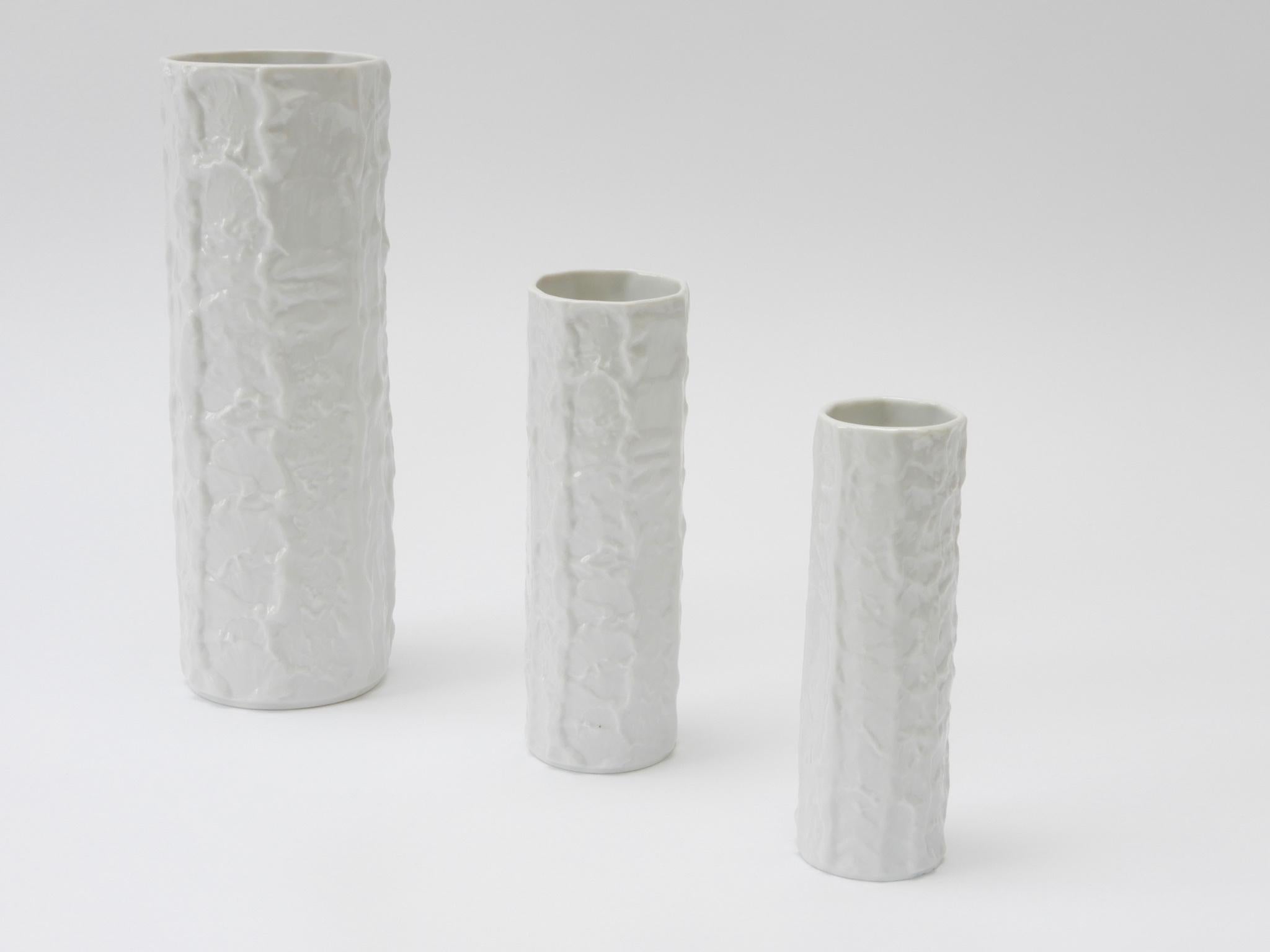 Set of three German white circular ceramic vases, 1960s.

Large size :-
D: 9cm
H: 26cm

Medium size:-
D: 6cm
H: 18.5cm

Small Size:-
D: 5cm
H: 16.5cm