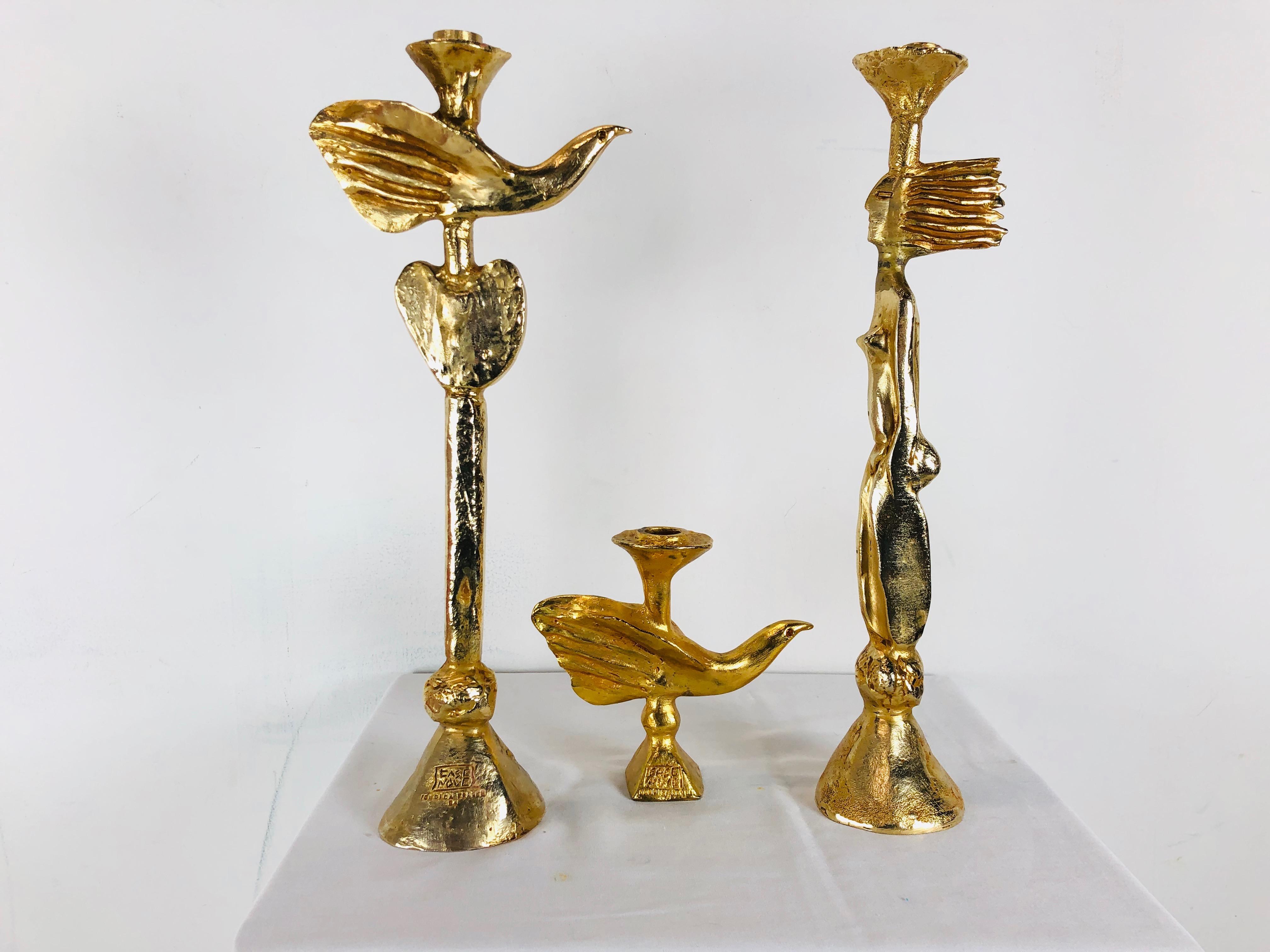 Set of three gilt bronze candlestick holders by Pierre Casenove for Fondica. These are heavy in weight and with a modern whimsical design.

Dimensions:
Large bird - 8 W x 4.5 D x 18.5 T
Small bird - 7.5 W x 2 D x 7 T
Woman - 4 W x 3.5 D x 18.5
