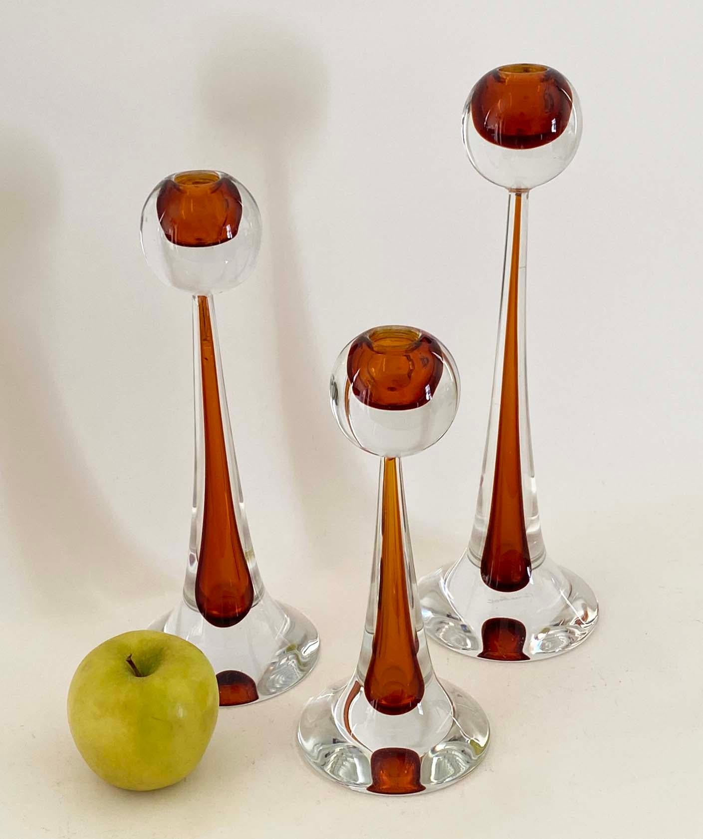 Here is a nice set of three Murano glass candlesticks by Gino Cenedese & Co. Each candlestick has an etched 'Cenedese' signature to the underside. Dimensions listed are for the largest candlestick. The medium candlestick measures 12