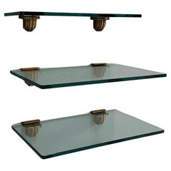 Set of three glass shelves with holder in bronze