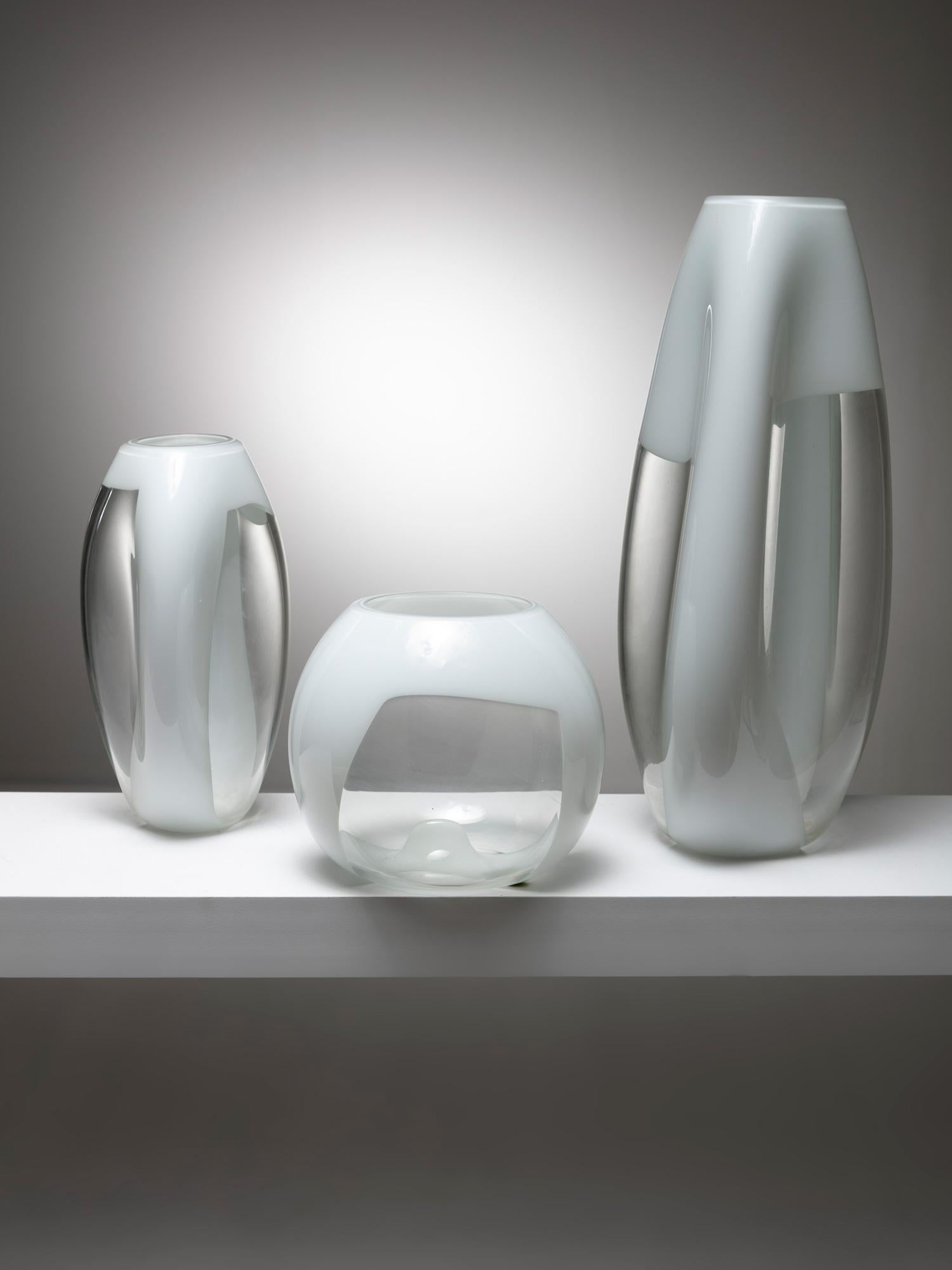 Glass vases models S614 S615 and S616 by Vetreria Vistosi.
Cristal vase with milky glass bands.
Size refers to the tallest piece.
Literature available upon request.