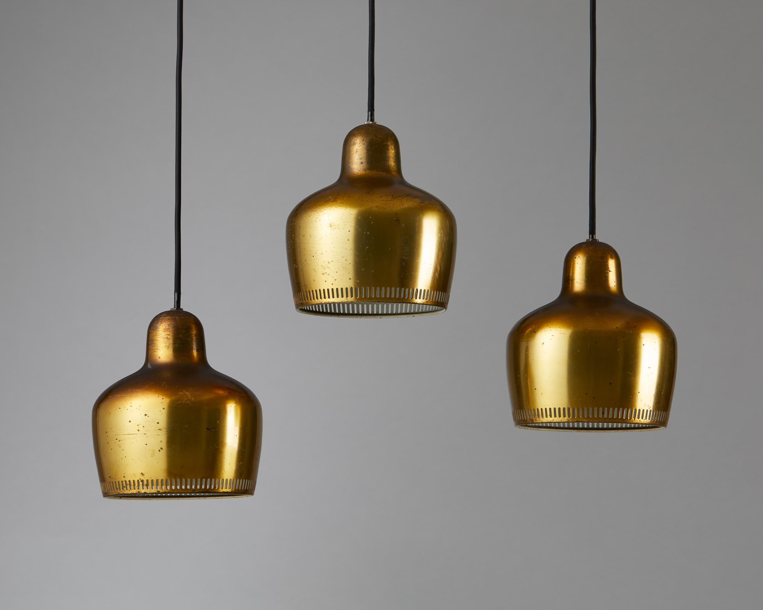 Set of three ‘Golden Bell’ ceiling lamps model A 330 designed by Alvar Aalto for Louis Poulsen.

Finland, 1950s.

Brass.

Stamped.

Measures: 
Height: 79 cm / 2' 7