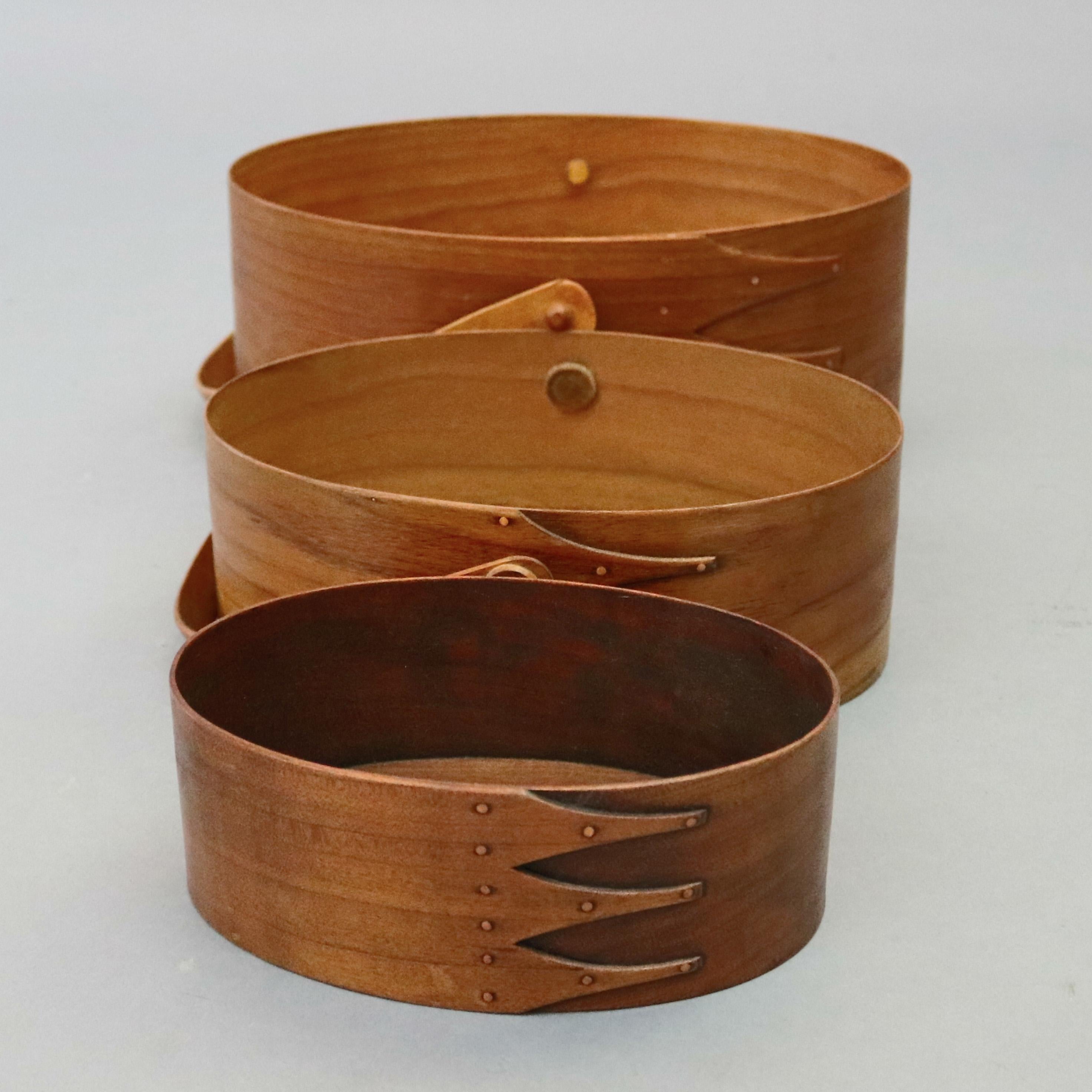 American Set of Three Graduated Oval Lesher School Handled Shaker Boxes, 20th Century