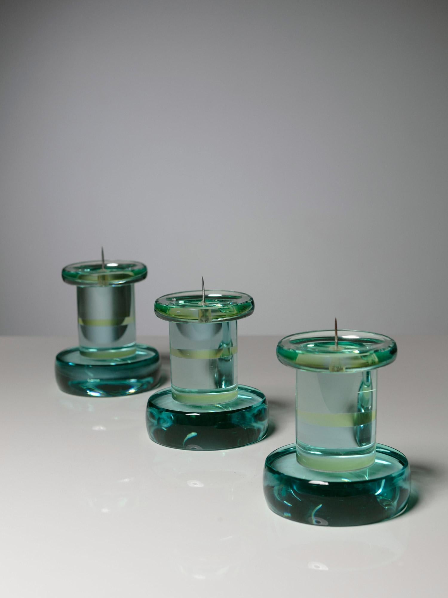 Set of three candle holders manufactured by Fontana Arte.
Bold rounded shapes made out of the classic green-Nile glass.