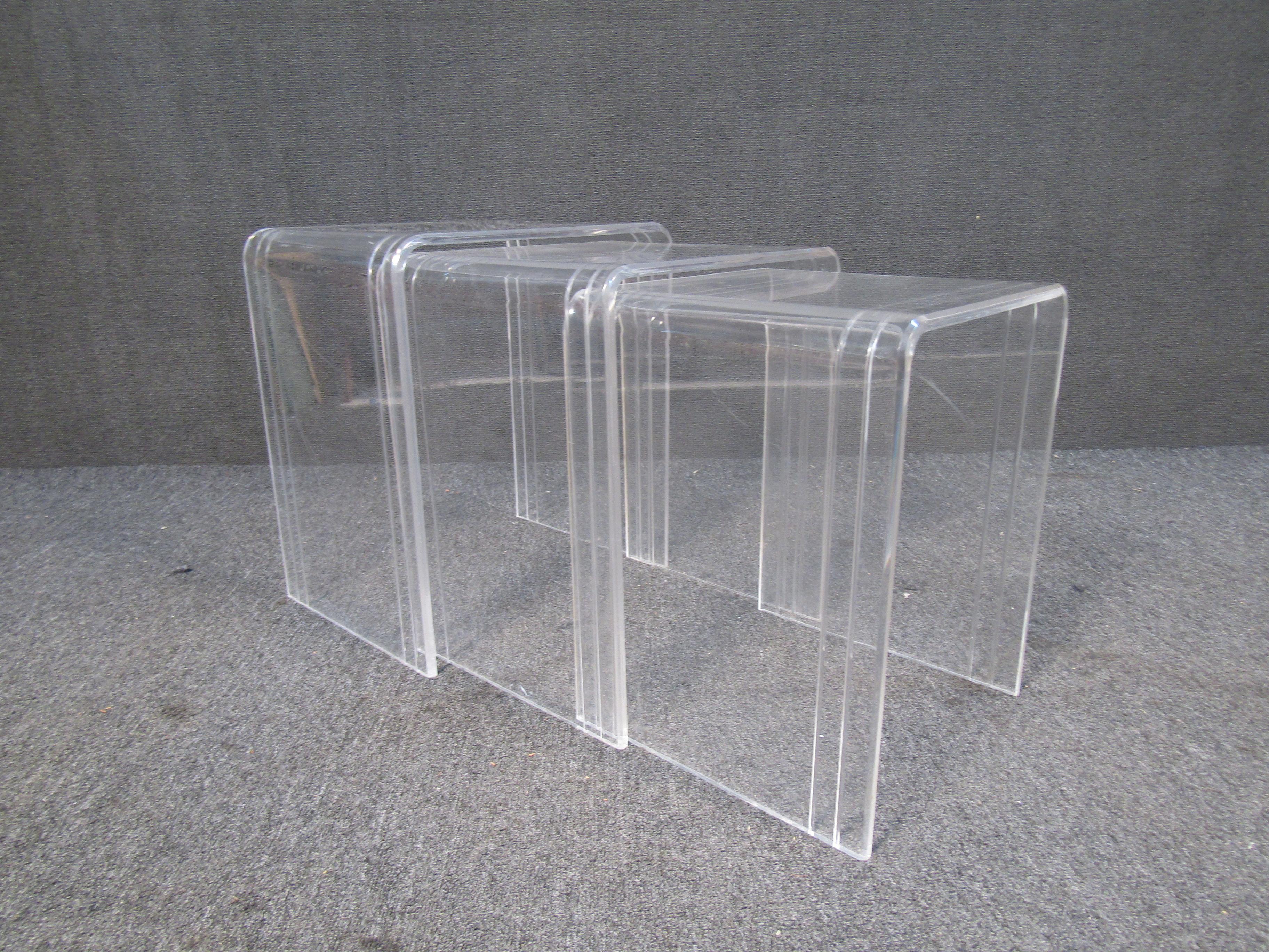 This set of three vintage nesting tables uses lucite for a sturdy and minimal design. Please confirm item location with seller (NY/NJ).