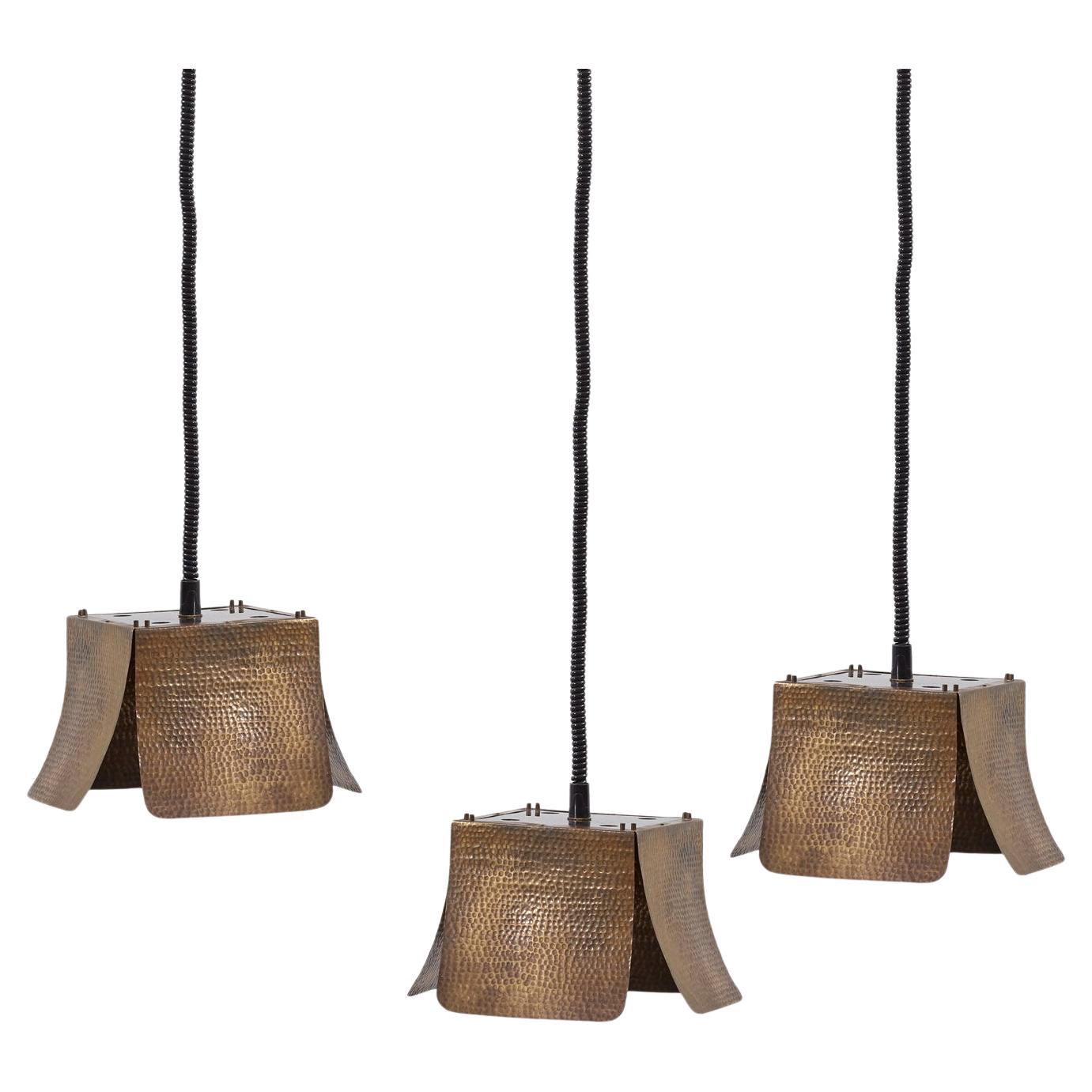 Set of three hammered ceiling lamps attributed to Tommaso Barbi - Italy, 1970s For Sale