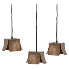 Set of three hammered ceiling lamps attributed to Tommaso Barbi - Italy, 1970s