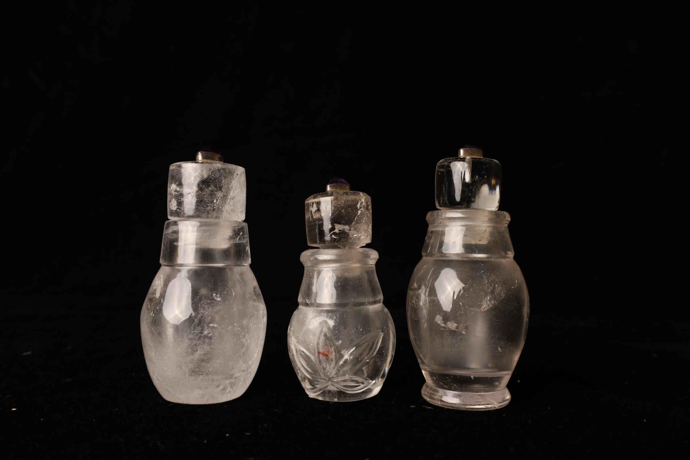 This elegant set of three crystal jars showcases refined craftsmanship and a timeless aesthetic. Each piece is meticulously hand-carved from clear crystal, featuring soft, flowing motifs that highlight the natural luminosity of the