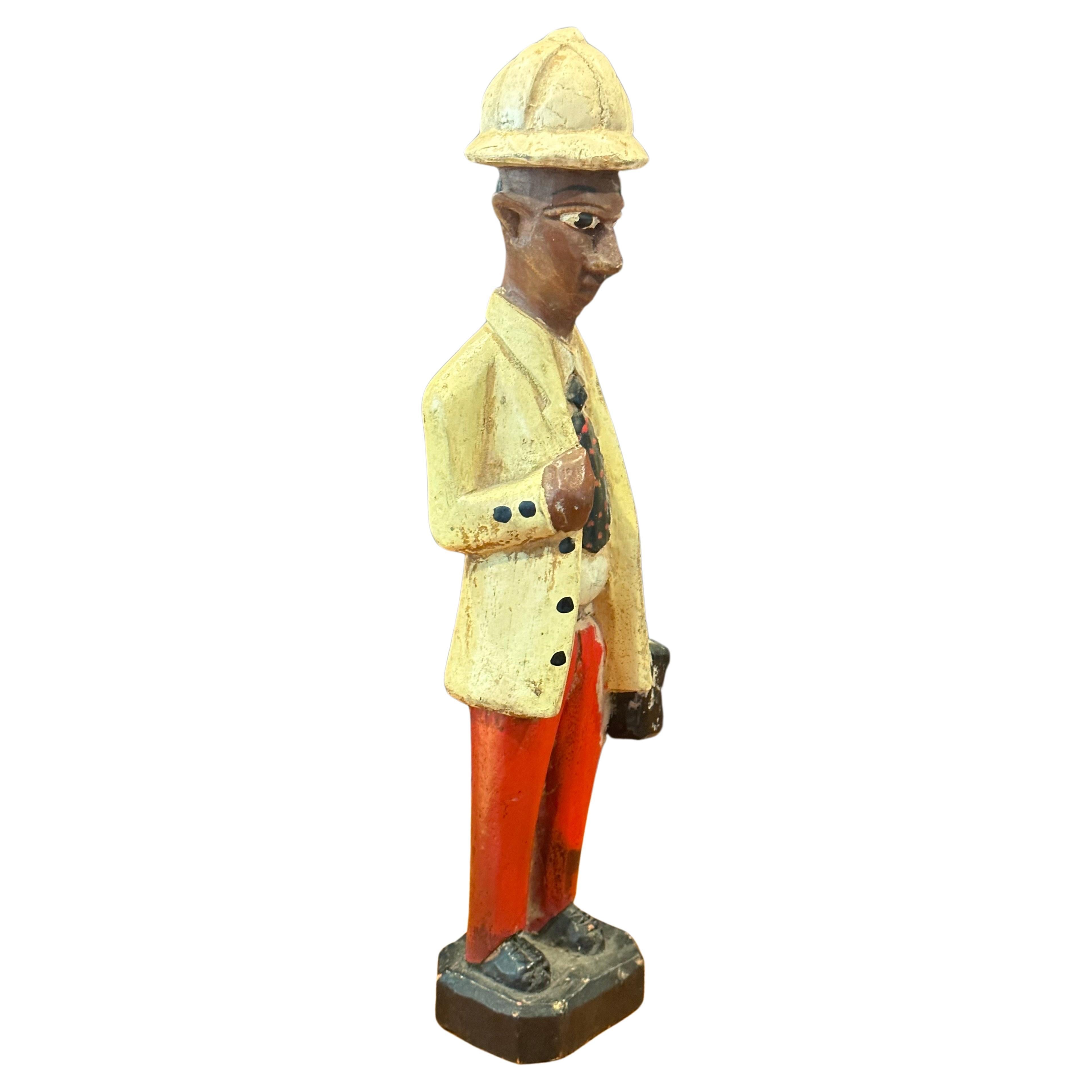 Set of three hand carved figural African polychromed colonial style sculptures, circa 1970s. The set is in good vintage condition and each figure measures approximately 3