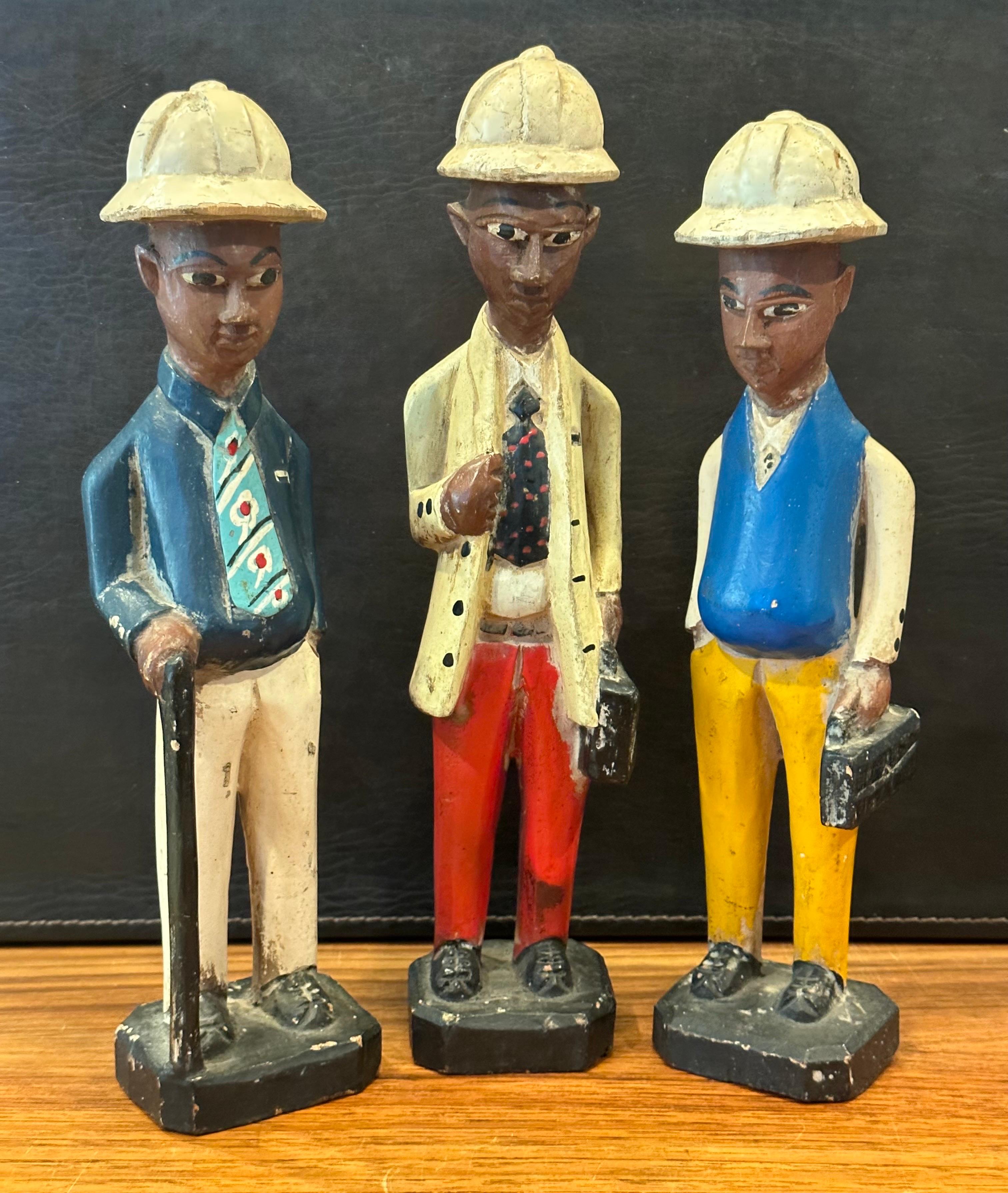20th Century Set of Three Hand Carved Figural African Polychromed Colonial Style Sculptures For Sale