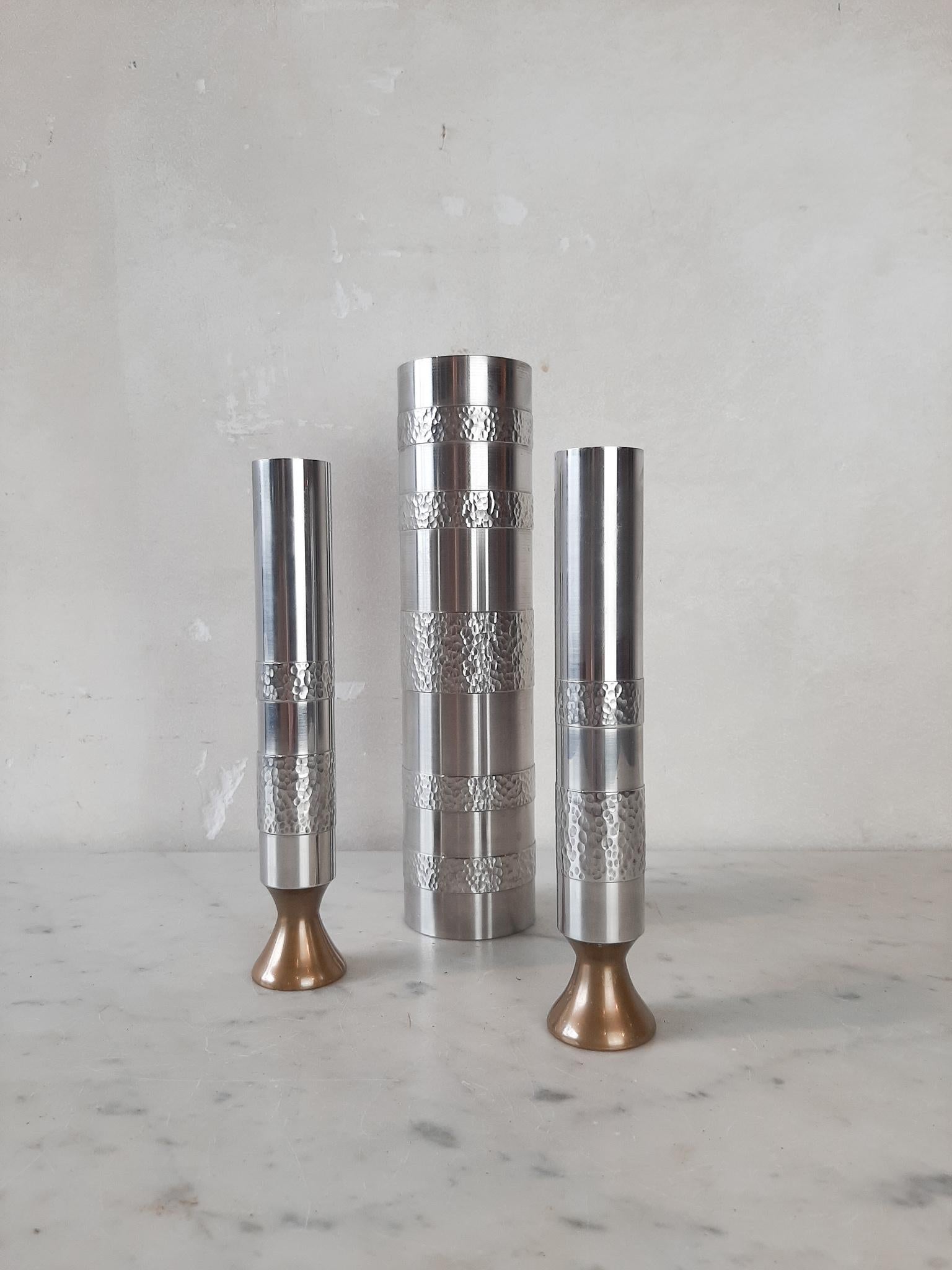 Set of three handmade metal Brutalist vases, produced in Germany 1970s. Made of very heavy stainless steel with the minimalistic 1970s design and the Brutalist decorative pattern made by the handcrafted sculptural surface structure of the steel.