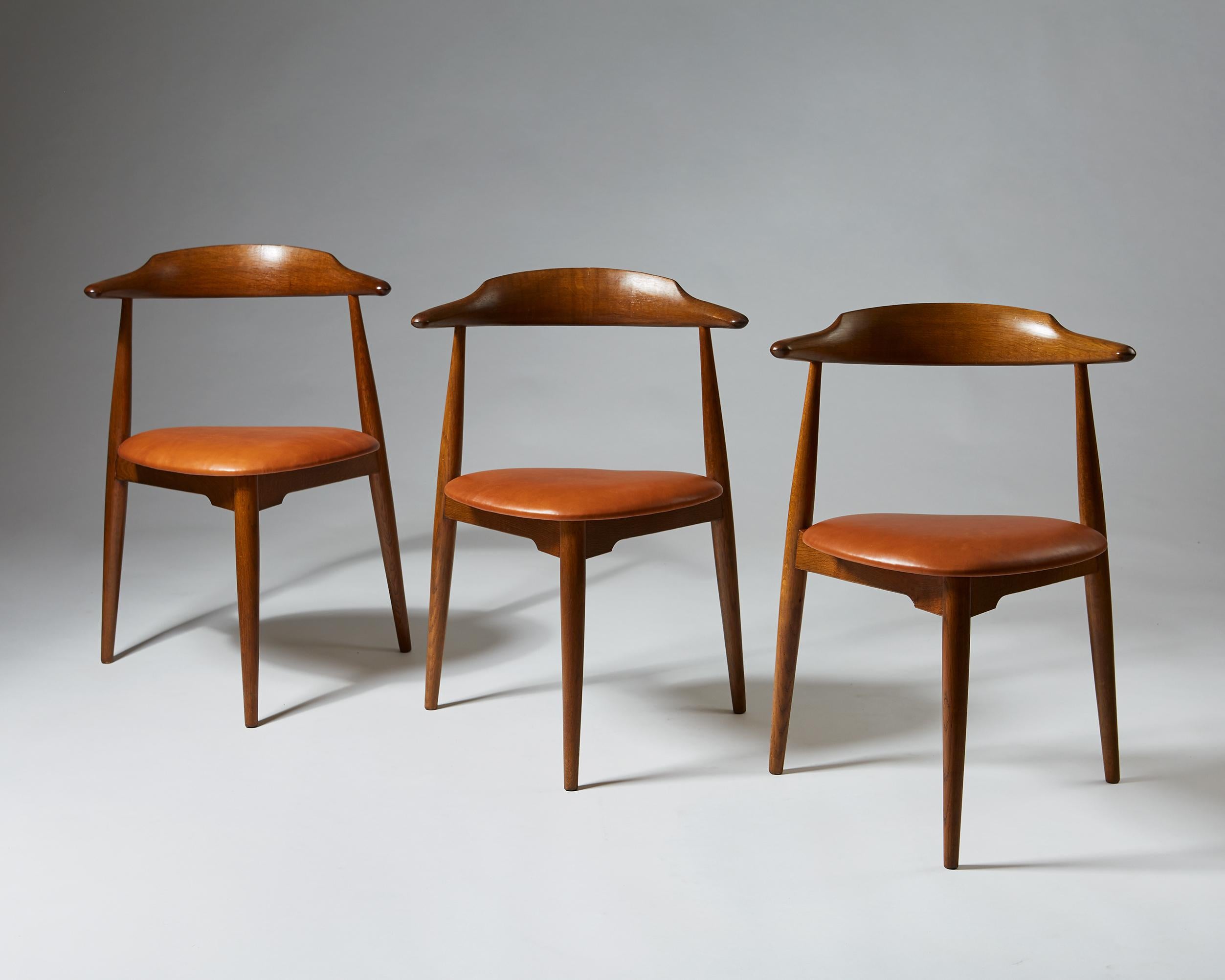 Set of three ‘Heart’ chairs model 4104 designed by Hans Wegner for Fritz Hansen, Denmark, 1952. 

Oak and leather.

 