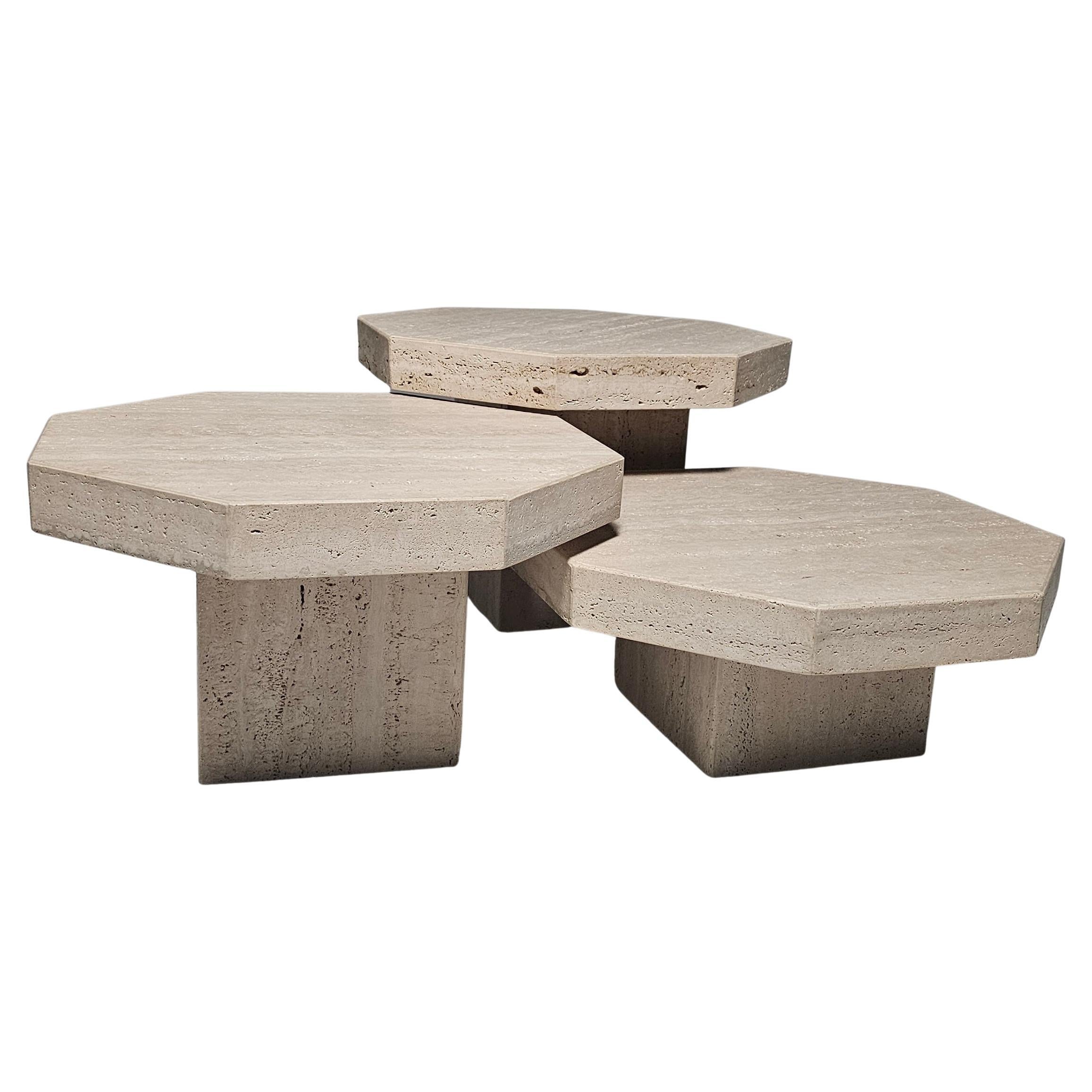 Set of three coffee tables, travertine, Italy, 1970s

This set of cocktail tables features an elegant design that clearly illustrates a balanced look. The hexagon shaped tables are architectural in their structure. Each tabletop rests on a single