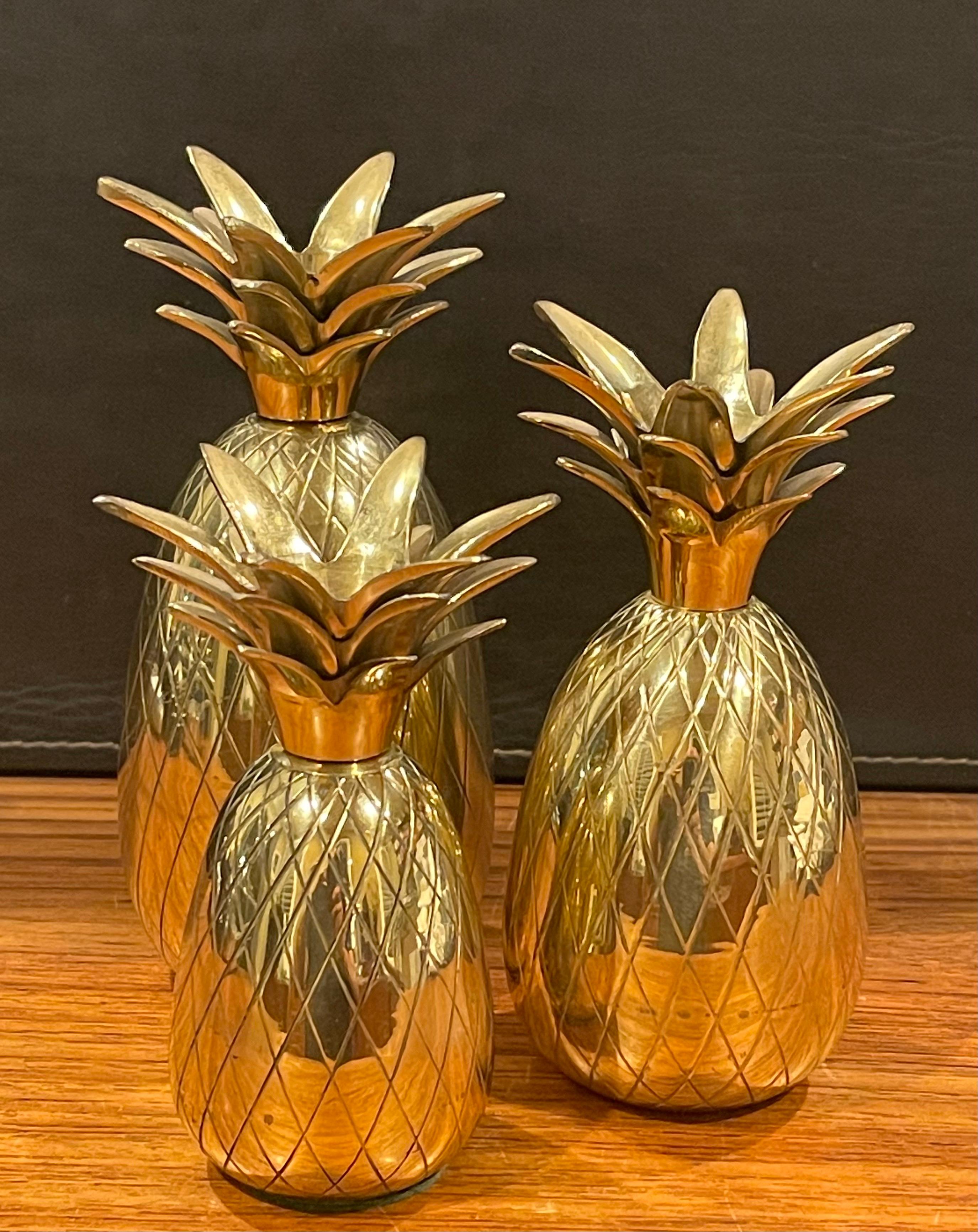 A very nice set of three hollywood regency brass pineapple candle holders, circa 1970s. The set is in very good vintage condition with a wonderful patina; the candles largest candle measures 3.5