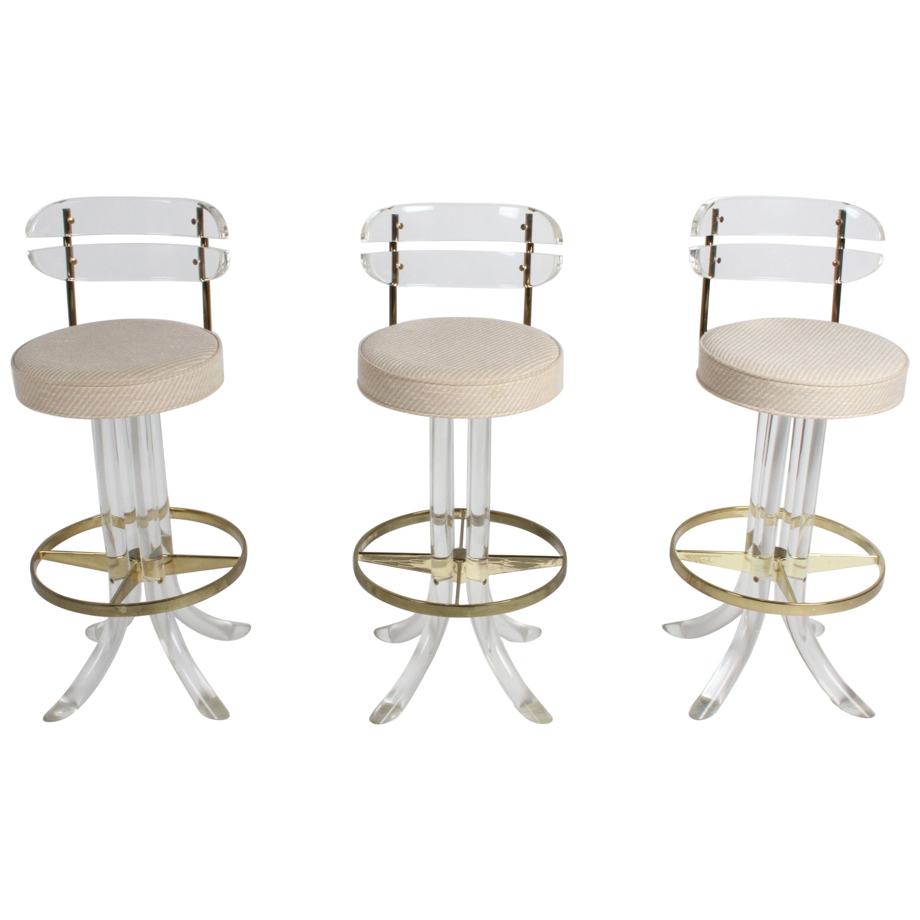 Set of Three Hollywood Regency Lucite with Brass Swivel Bar Stools by Hill MFG