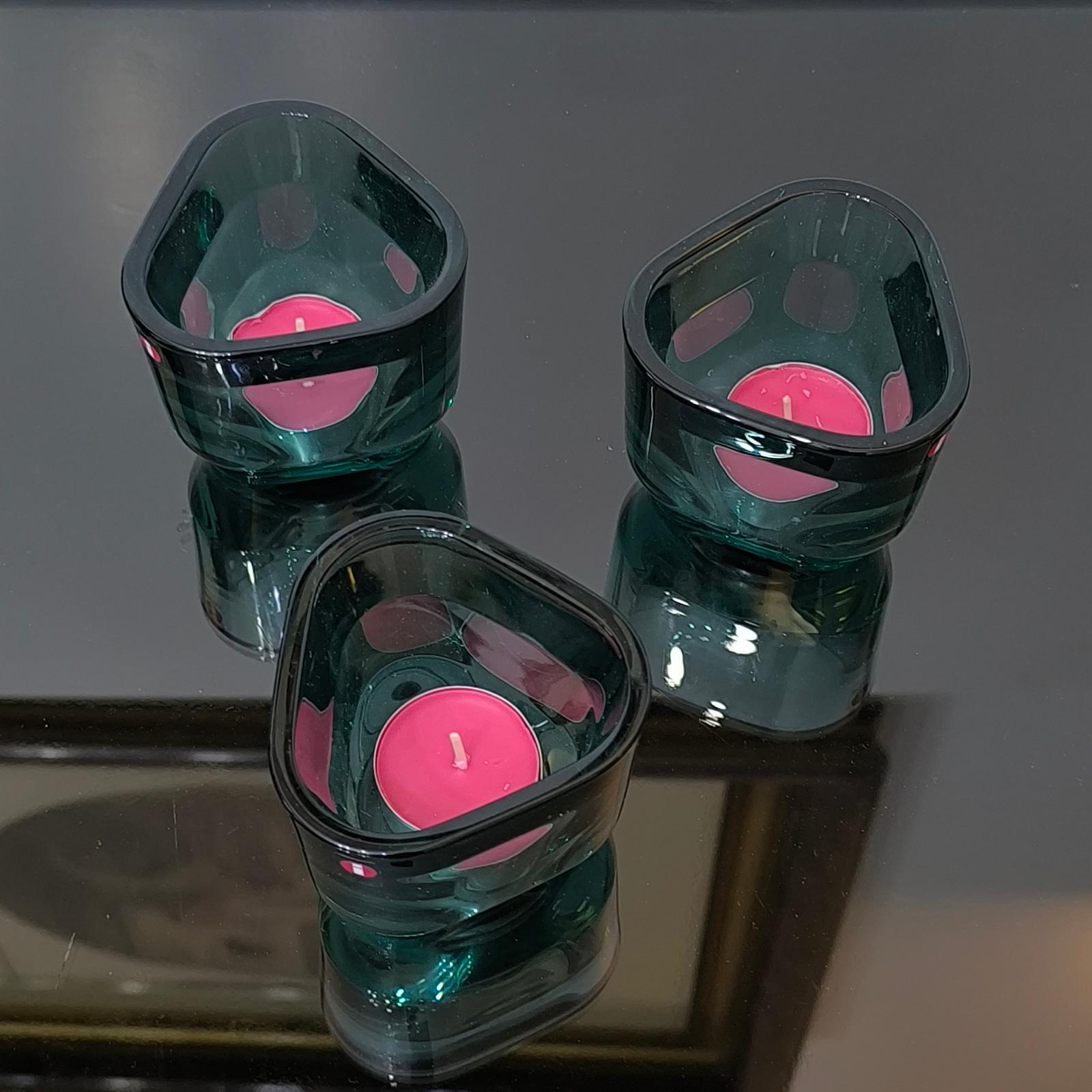 Set of Three Iittala Candle Holders, Votives, Sea-blue Crystal, Made in Finland.
All 3 are in excellent condition.
Height 7 cm.
Perfect for the winter holidays or to make a gift to a friend!