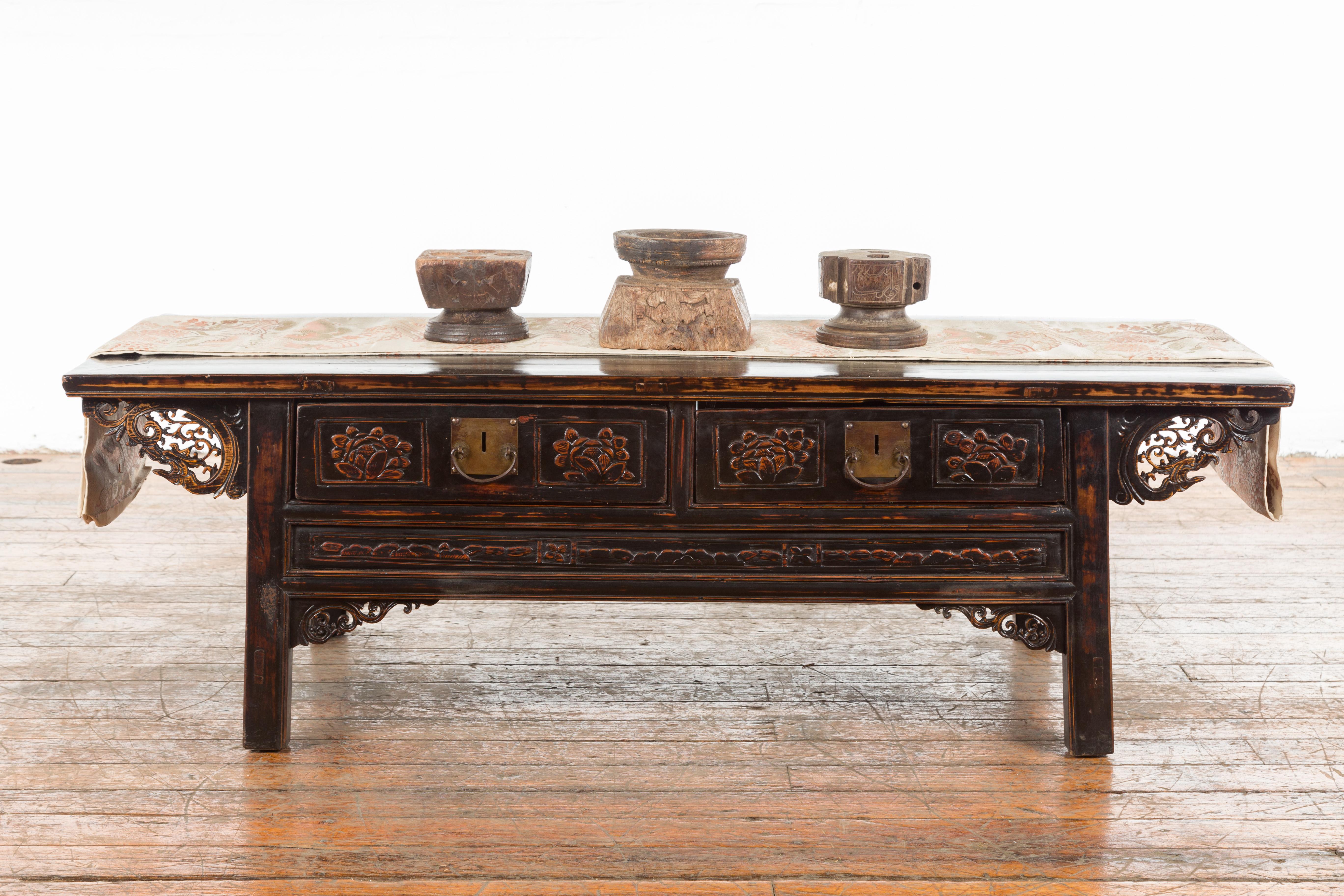 A set of three Indian seed planters from the 19th century, with distressed patina. Created in India during the 19th century, these wooden pieces were originally used for planting seeds. Boasting a nicely weathered appearance, each piece features a