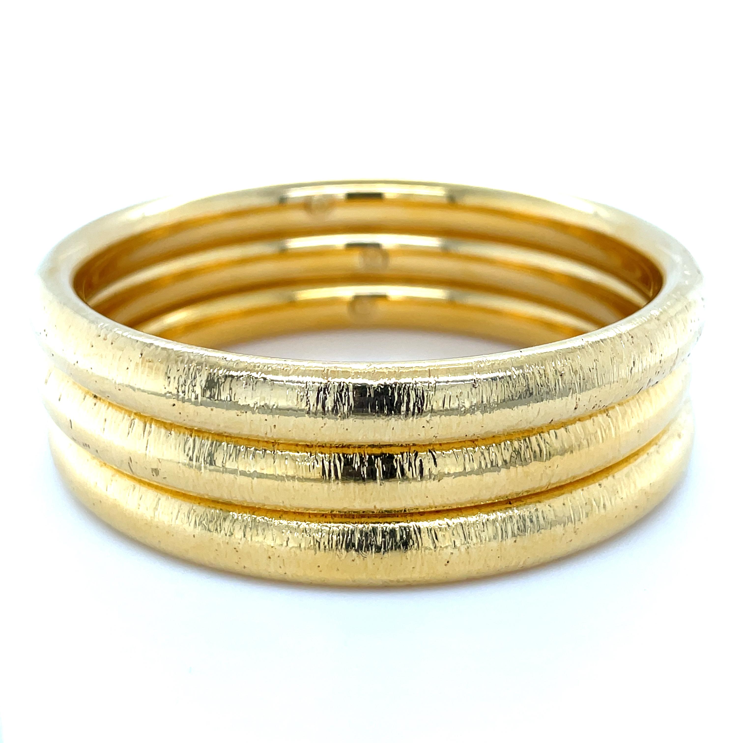 These three hollow form bangles made by the Italian company Milor are beautifully made with a brushed finish, these bangles have a high end look to them and are light and easy to wear!

Stamp: MILOR ITALY 14K.
Measurements: 7 3/4 inches inner