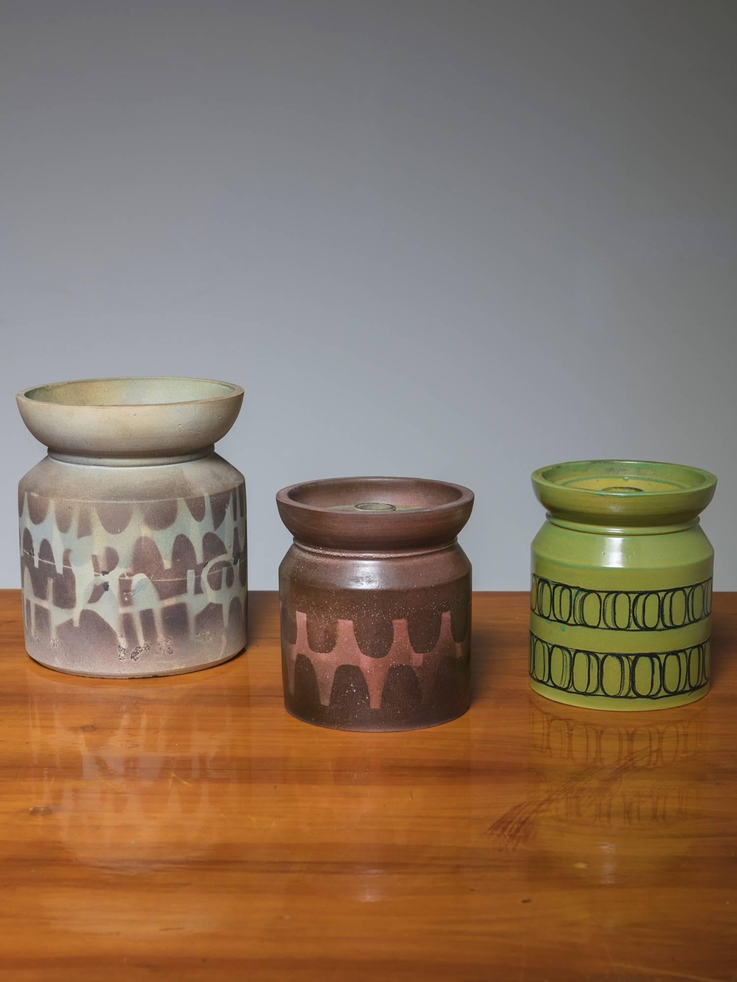 Remarkable set of three ceramic pieces with different decorations.
Two pieces feature matching lids. Size refers to the tallest piece.