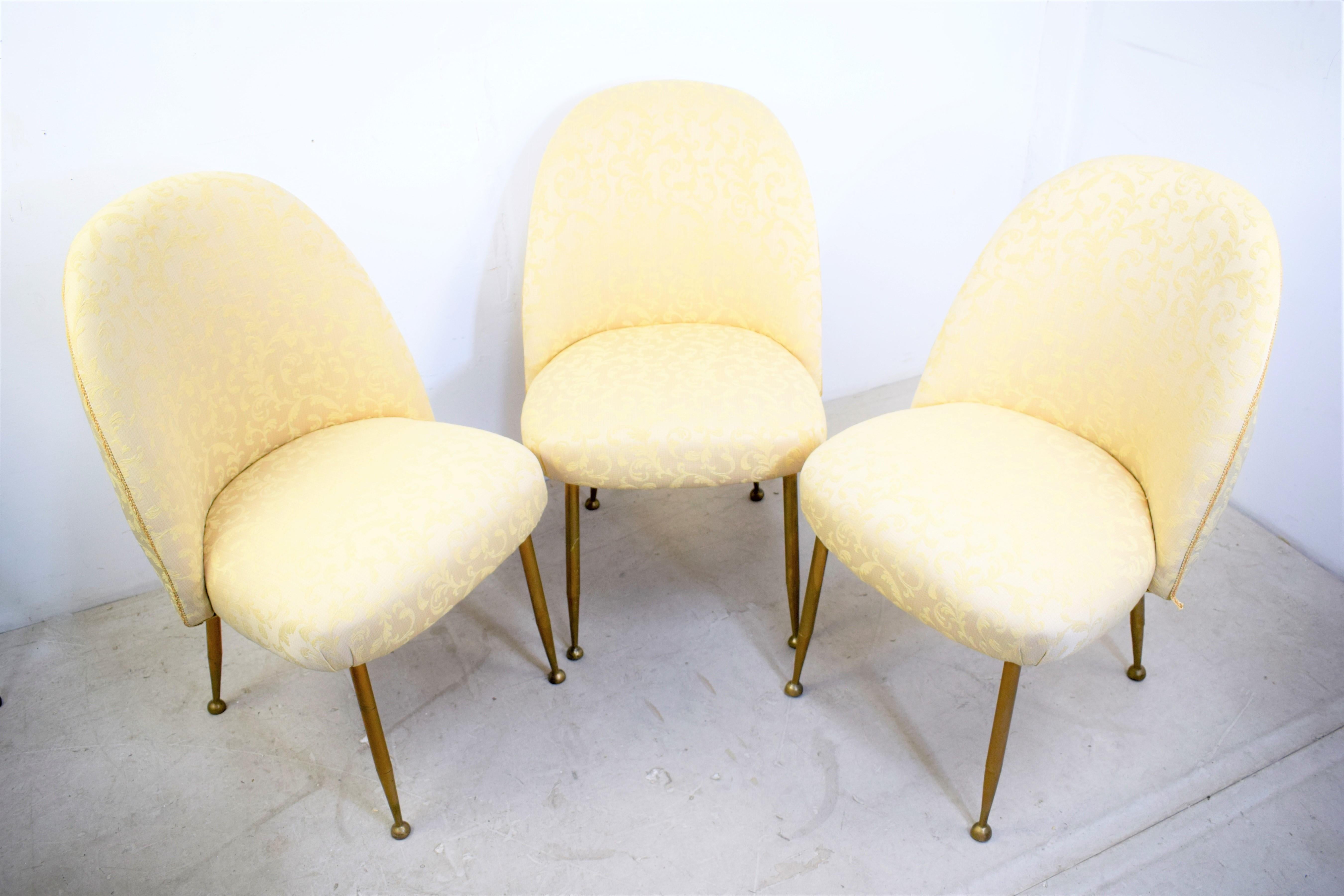 Set of three italian armchairs, 1960s.

Dimensions: H= 80 cm; W= 40 cm; D= 52 cm; Height seat= 42 cm.