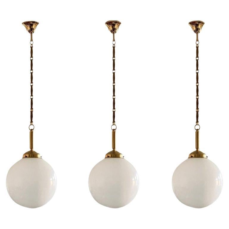 Set of Three Italian Art Deco Hand Blown Opaline Glass Brass Pendants, 1940s