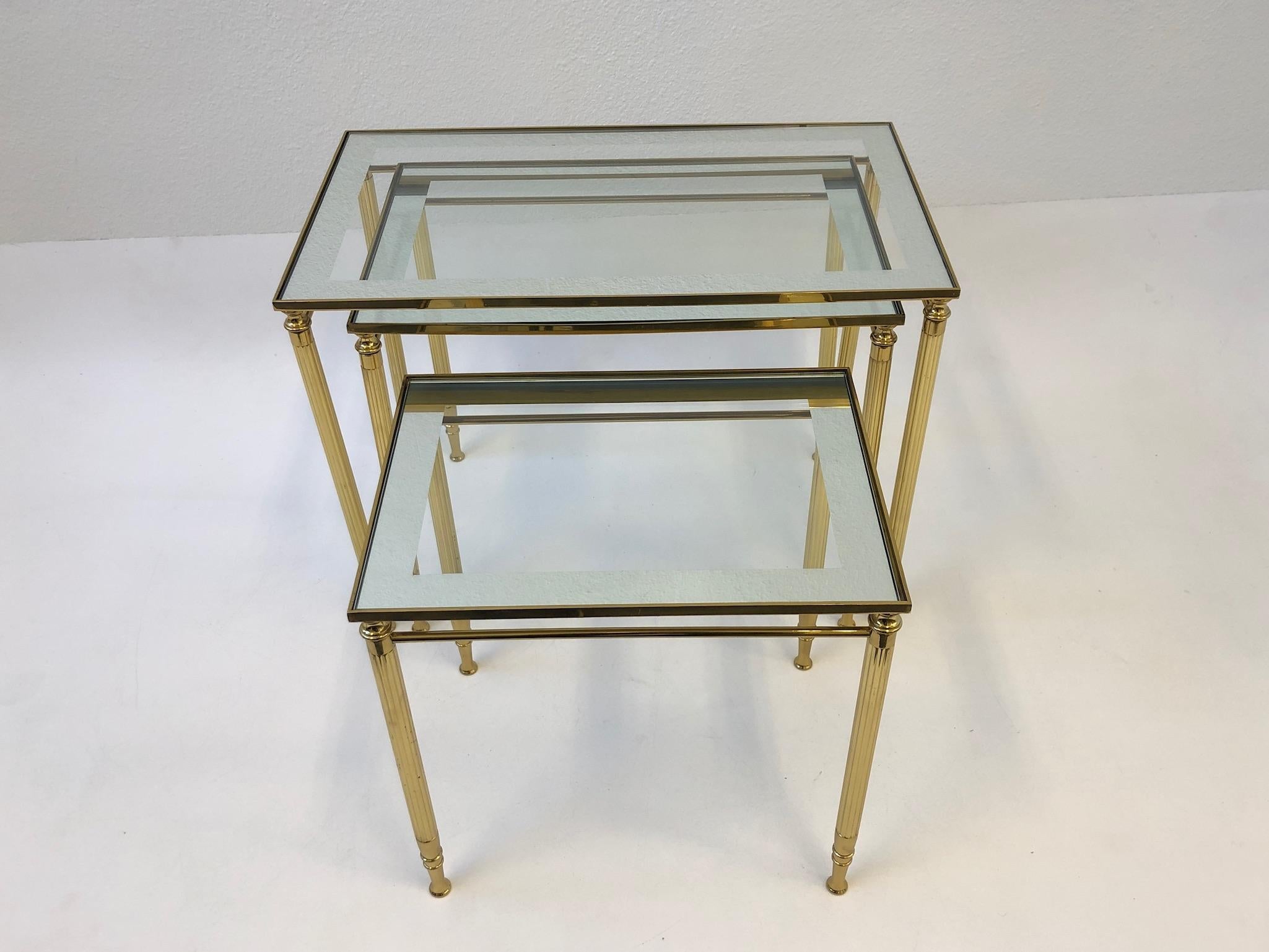 Hollywood Regency Set of Three Italian Brass and Glass Nesting Tables by Maison Baguès