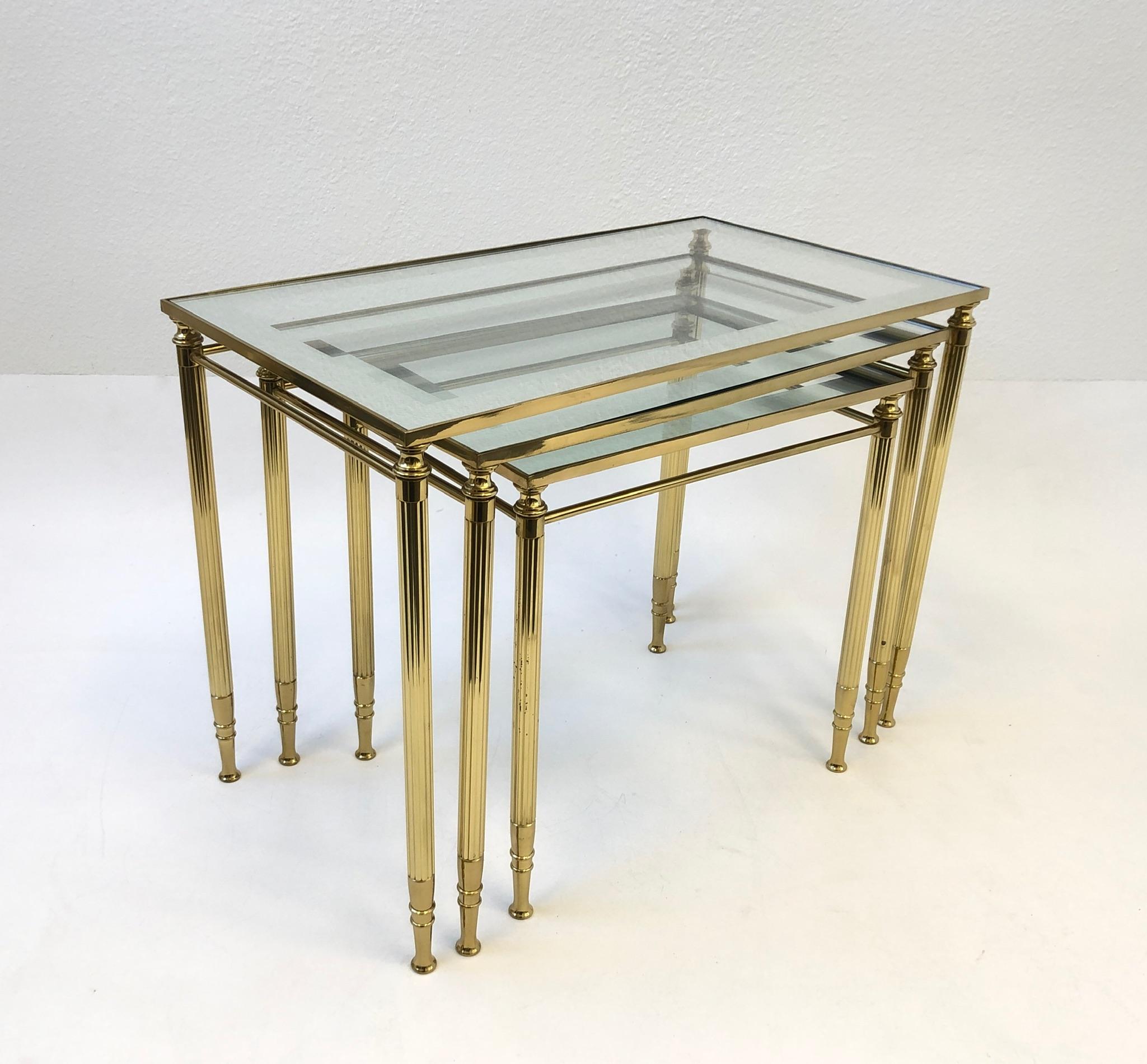 Late 20th Century Set of Three Italian Brass and Glass Nesting Tables by Maison Baguès