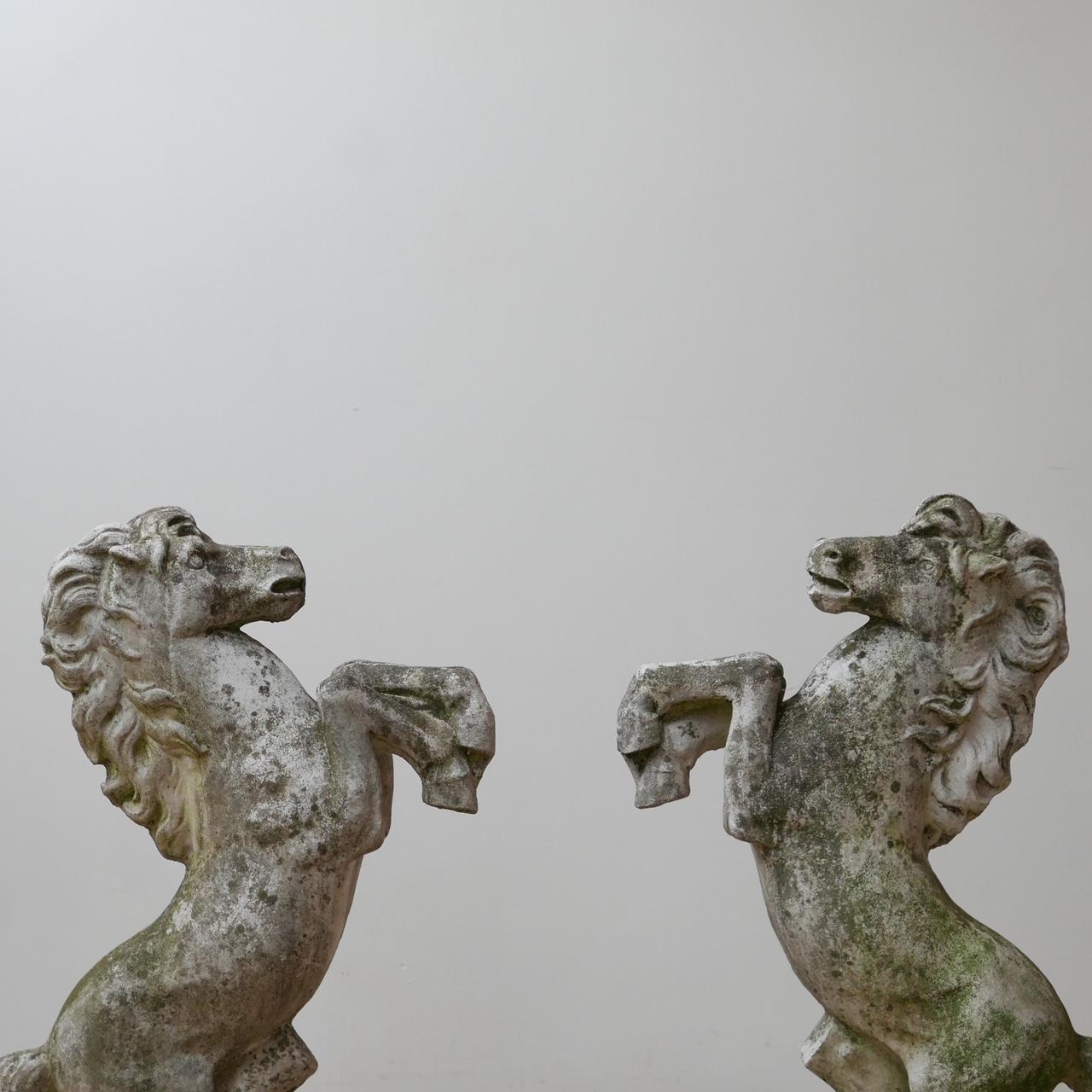 A trio of garden prancing horses.

Italian, early to mid-20th century.

One pair and one larger model.

Composition of some kind, lovely patina formed over years. They look amazing inside or out.

Small crack on bigger horses legs, but