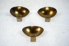 Set of three Italian Deco-style brass wall sconces, Italy 1970s