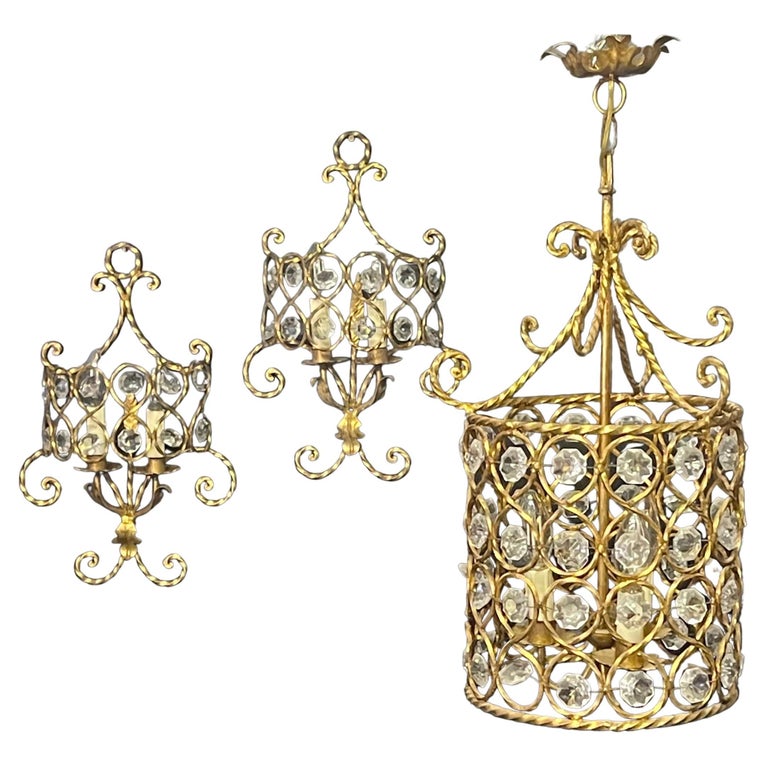 Set of Three Italian Gilt Iron and Crystal Light Fixtures, circa 1950s